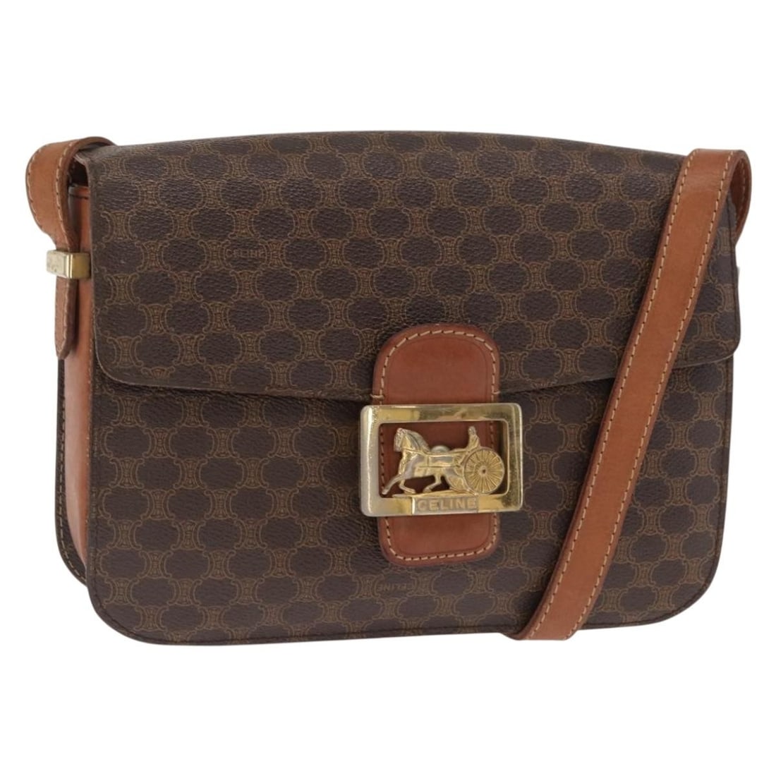 Celine Vintage Horse Carriage Macadam PVC Shoulder Bag Brown: Celine Vintage Horse Carriage Macadam PVC Shoulder Bag Brown This vintage Celine Horse Carriage Macadam shoulder bag features a brown PVC canvas exterior with leather accents. Designed for women, it h