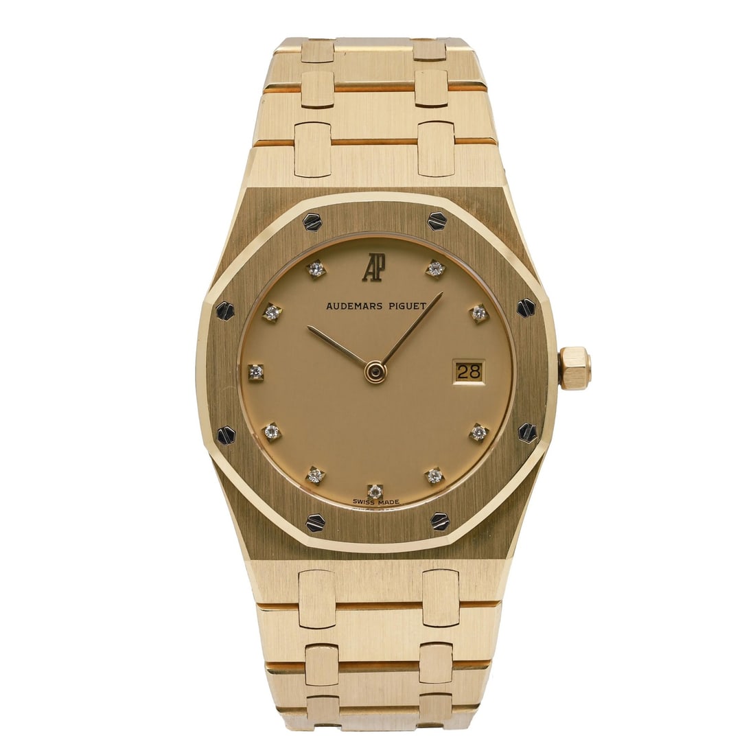 Audemars Piguet Royal Oak 33mm Quartz Yellow Gold Champagne Dial Watch: Audemars Piguet Royal Oak 33mm Quartz Yellow Gold Champagne Dial Watch This Audemars Piguet Royal Oak wristwatch features a 33mm yellow gold case with a distinctive octagonal shape and a champagne dia