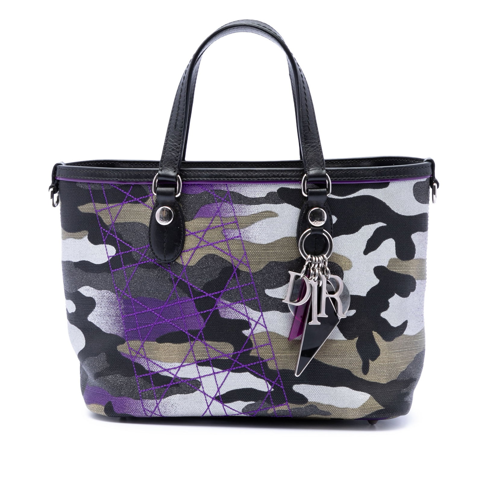 Dior Anselm Reyle camouflage mini shopping tote in canvas: Dior Anselm Reyle camouflage mini shopping tote in canvas Dior Anselm Reyle Mini Shopping Tote in camouflage canvas with leather trim and flat leather handles. The open-top design includes interior zi