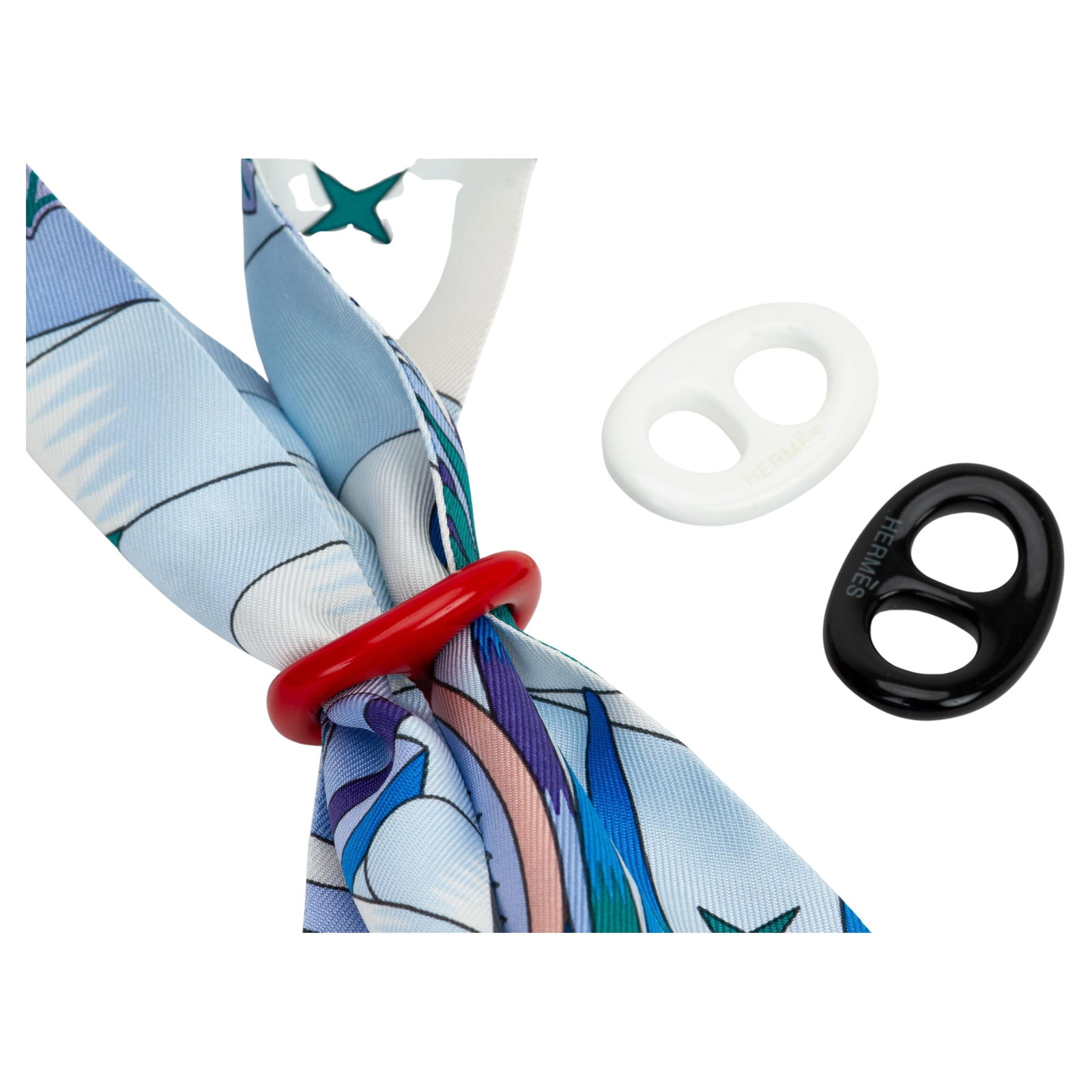 Hermes Tribord Chaine d'Ancre scarf ring trio with box: Hermes Tribord Chaine d'Ancre scarf ring trio with box This set includes three Hermes Tribord Chaine d'Ancre scarf rings in red, white, and black. Crafted from plastic, these stylish accessories are d
