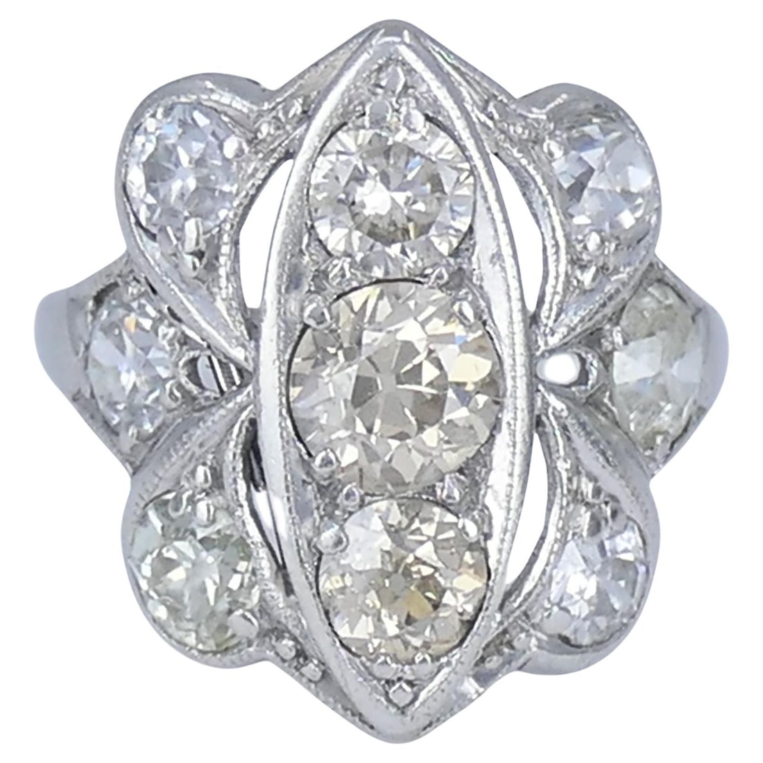 Platinum Old European Cut Diamond Cluster Ring Art Deco 1930s: Platinum Old European Cut Diamond Cluster Ring Art Deco 1930s Vintage Art Deco diamond cluster ring crafted in platinum and dating to approximately the 1930s. The design features a sculptural navette-