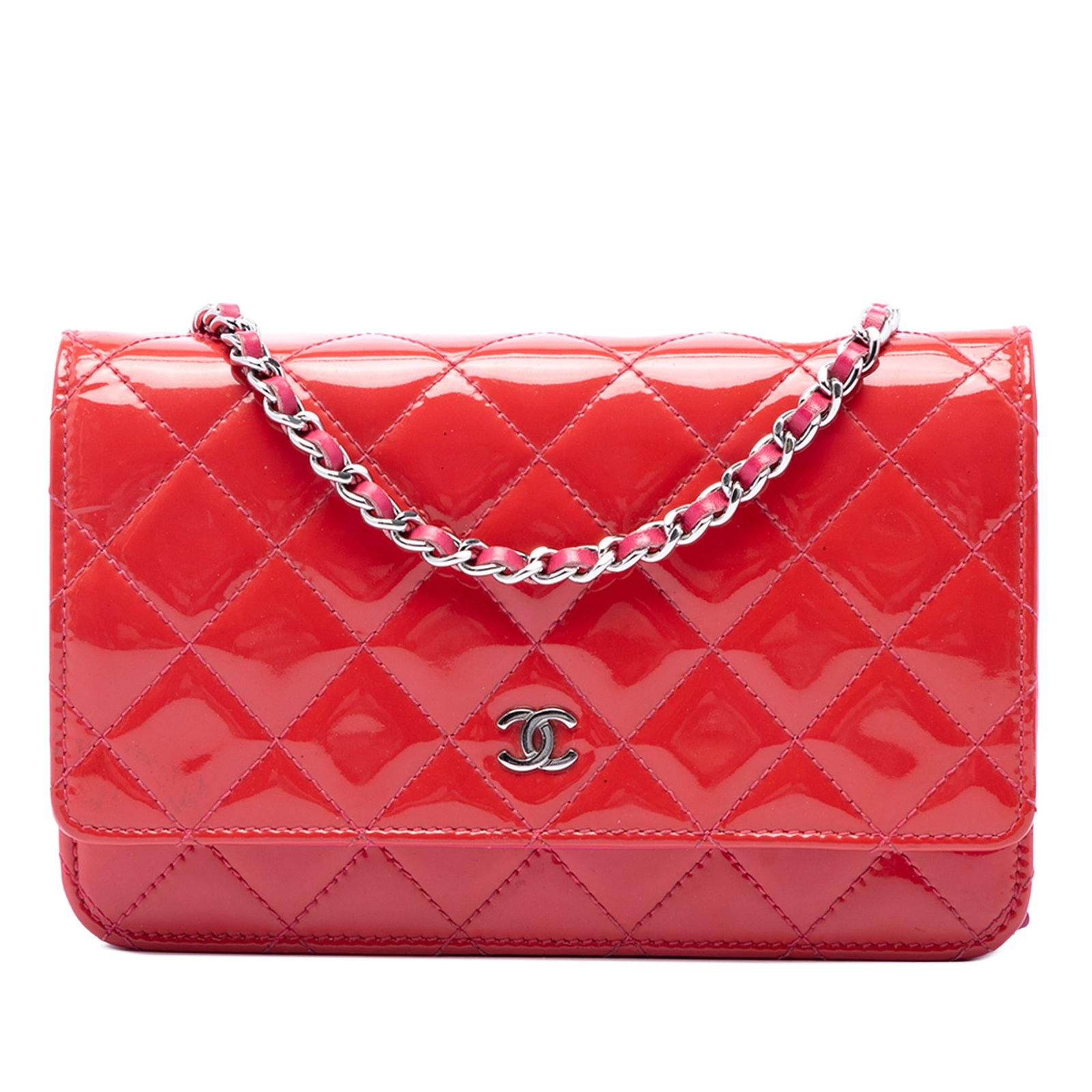 Chanel Bicolor Classic WOC in Red Patent Leather: Chanel Bicolor Classic WOC in Red Patent Leather This Chanel Wallet on Chain is crafted with a quilted patent leather body and contrast stitching. The design includes a leather-woven chain strap, a fr