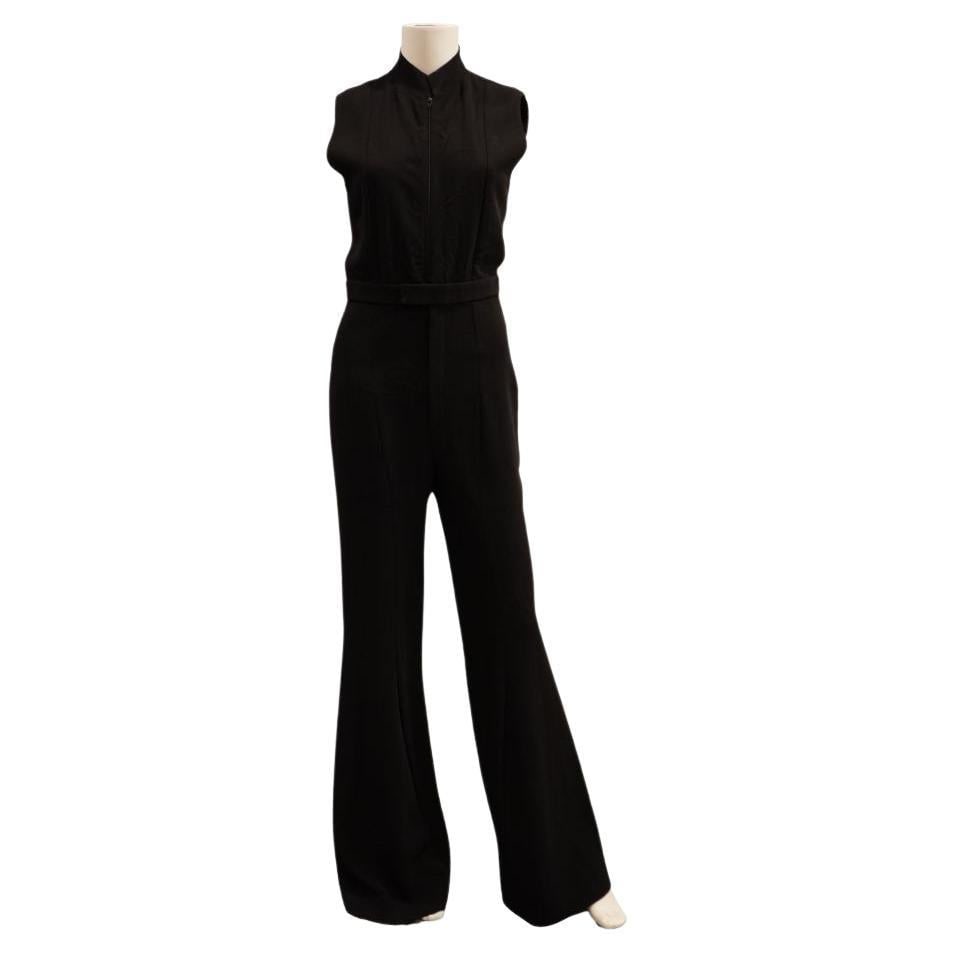 Nina Ricci Size 36 Sleeveless Black Wool Jumpsuit: Nina Ricci Size 36 Sleeveless Black Wool Jumpsuit Black sleeveless wool jumpsuit by Nina Ricci, made in France in the 21st century. It is marked size 36 and features a good condition overall. The piec