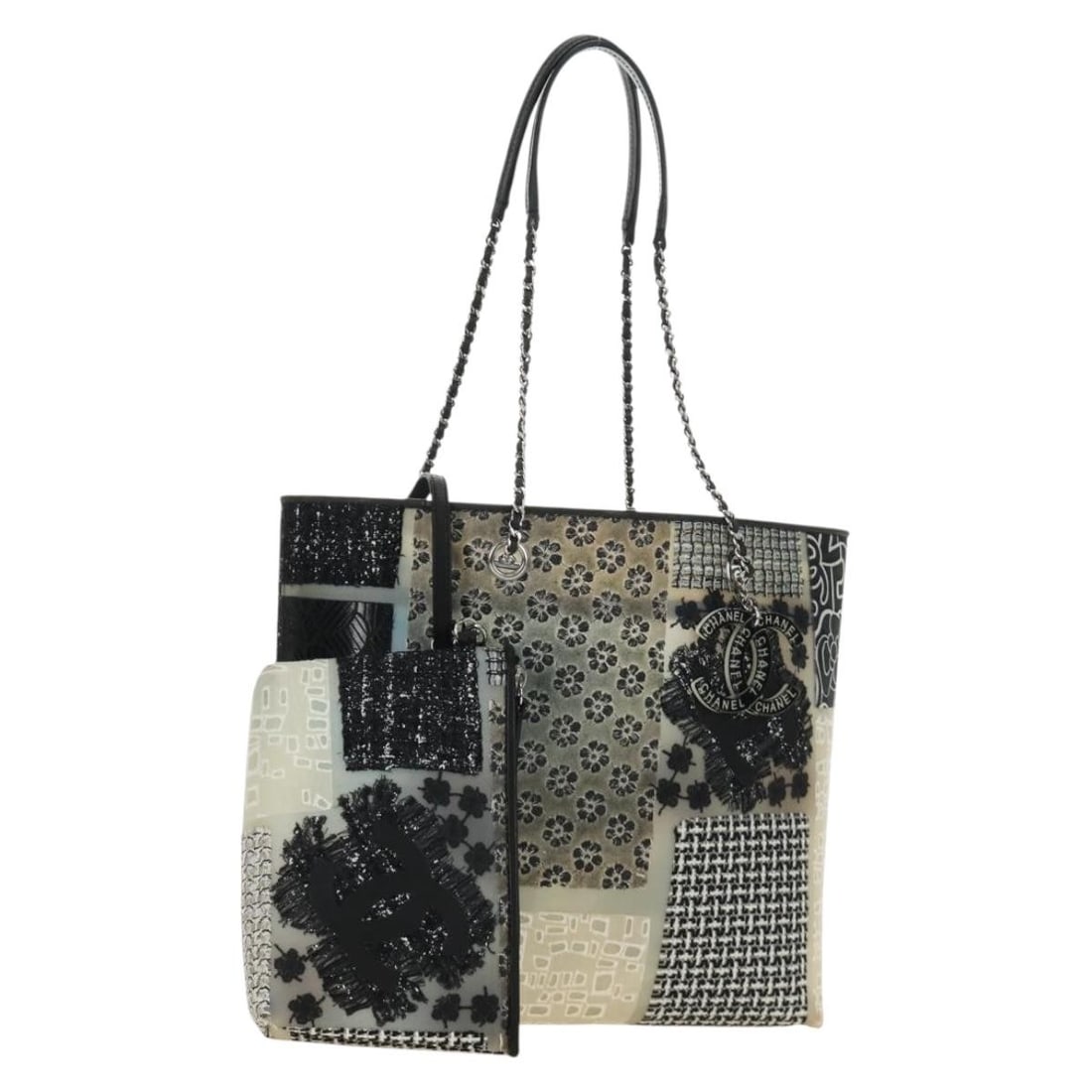 CHANEL Rubber Tote Bag Black Silver with Pouch: CHANEL Rubber Tote Bag Black Silver with Pouch Patchwork tote bag in black and silver rubber with an included pouch. Made in Italy, this women's tote is in AB very good condition with light signs of u