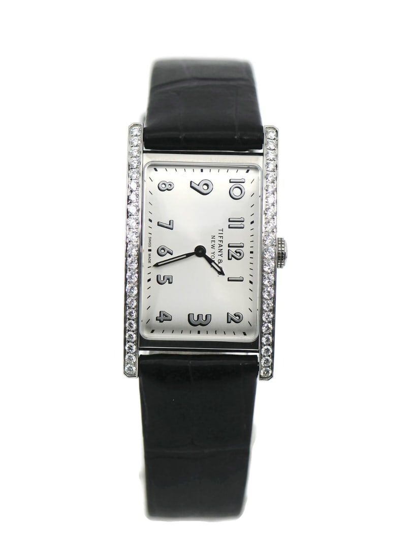 Tiffany & Co East West Women's Quartz Leather Strap Watch: Tiffany & Co East West Women's Quartz Leather Strap Watch This Tiffany & Co. East West Diamond watch features a stainless steel case with a striking silver dial and elegant diamond accents. Designed f