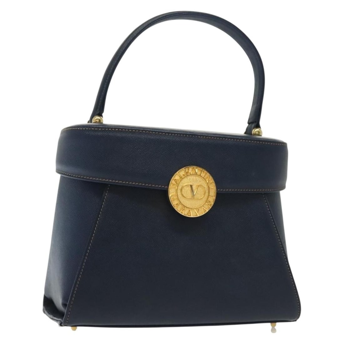 Valentino Garavani Vintage Navy Leather Handbag Made in Italy: Valentino Garavani Vintage Navy Leather Handbag Made in Italy This vintage Valentino Garavani handbag is crafted from navy leather and designed for women. It features a classic silhouette with a singl