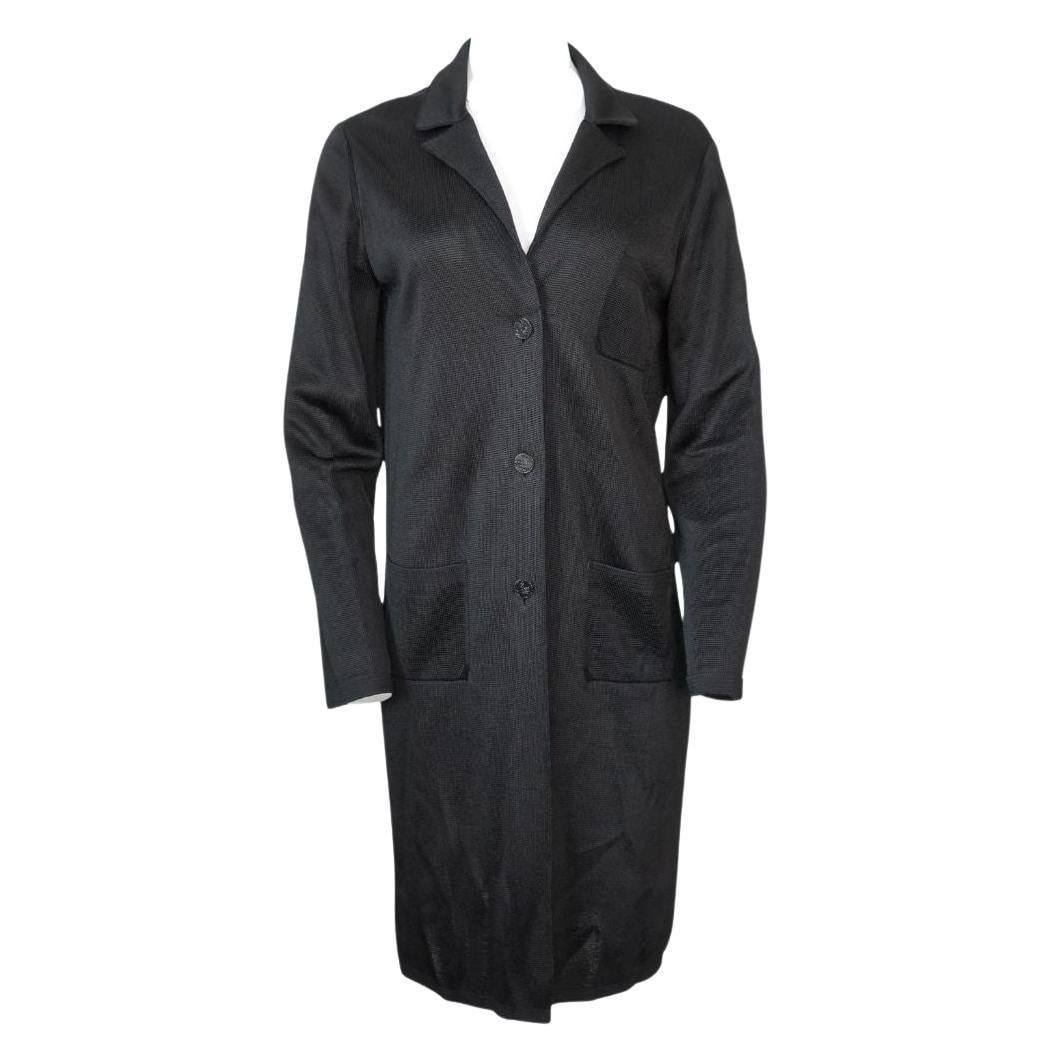 Chanel 2009 black knit long jacket size 42: Chanel 2009 black knit long jacket size 42 Black long knit jacket from Chanel, dated 2009. It features a 3-button closure and a heavyweight construction. The jacket is in excellent condition and is ma