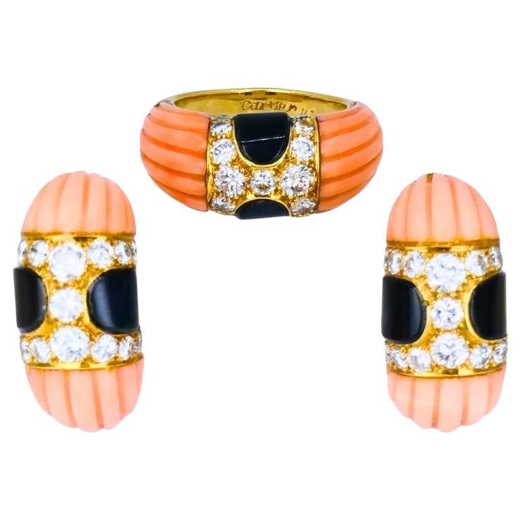 Cartier 18k Yellow Gold Ring and Earring Set with Coral Onyx Diamonds: Cartier 18k Yellow Gold Ring and Earring Set with Coral Onyx Diamonds Vintage Cartier jewelry set featuring a ring and matching earrings in 18k yellow gold with coral, black onyx, and round brilliant 