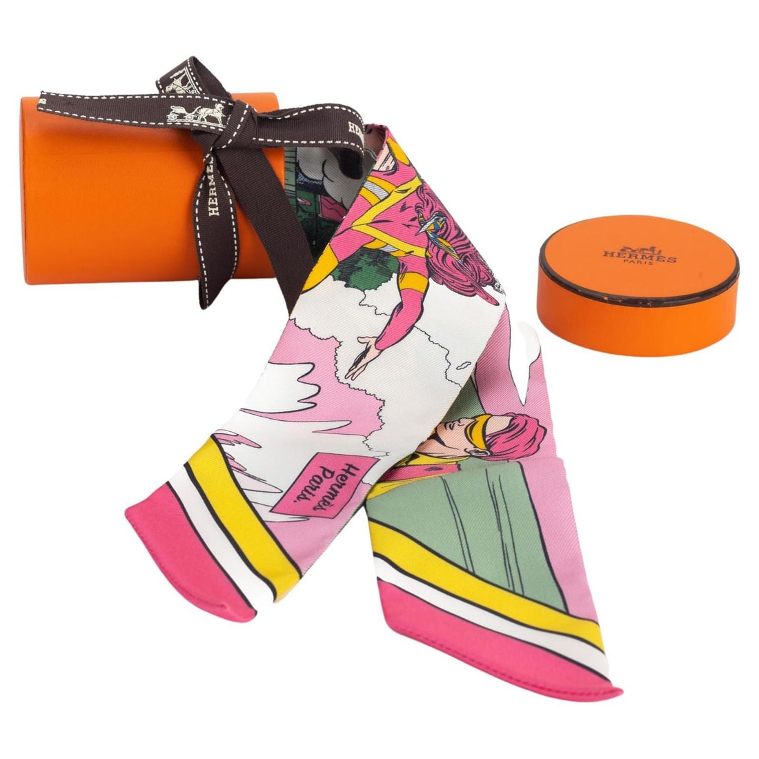 Hermes Comic Twilly Scarf Rose Pink New in Box: Hermes Comic Twilly Scarf Rose Pink New in Box Introducing the exquisite Hermes Comic Twilly, a stunning accessory that effortlessly combines fashion and art. This delightful twilly features a whimsic