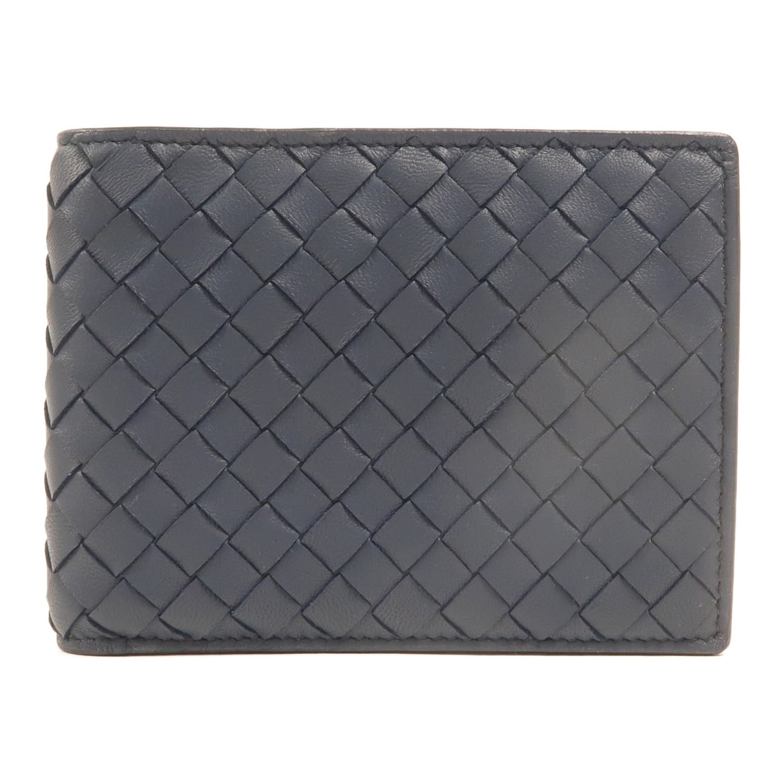 Bottega Veneta BV bi fold lambskin wallet in navy: Bottega Veneta BV bi fold lambskin wallet in navy Bottega Veneta bi-fold wallet crafted from lambskin leather in navy blue. This unisex wallet features a compact fold-over design with organized interi