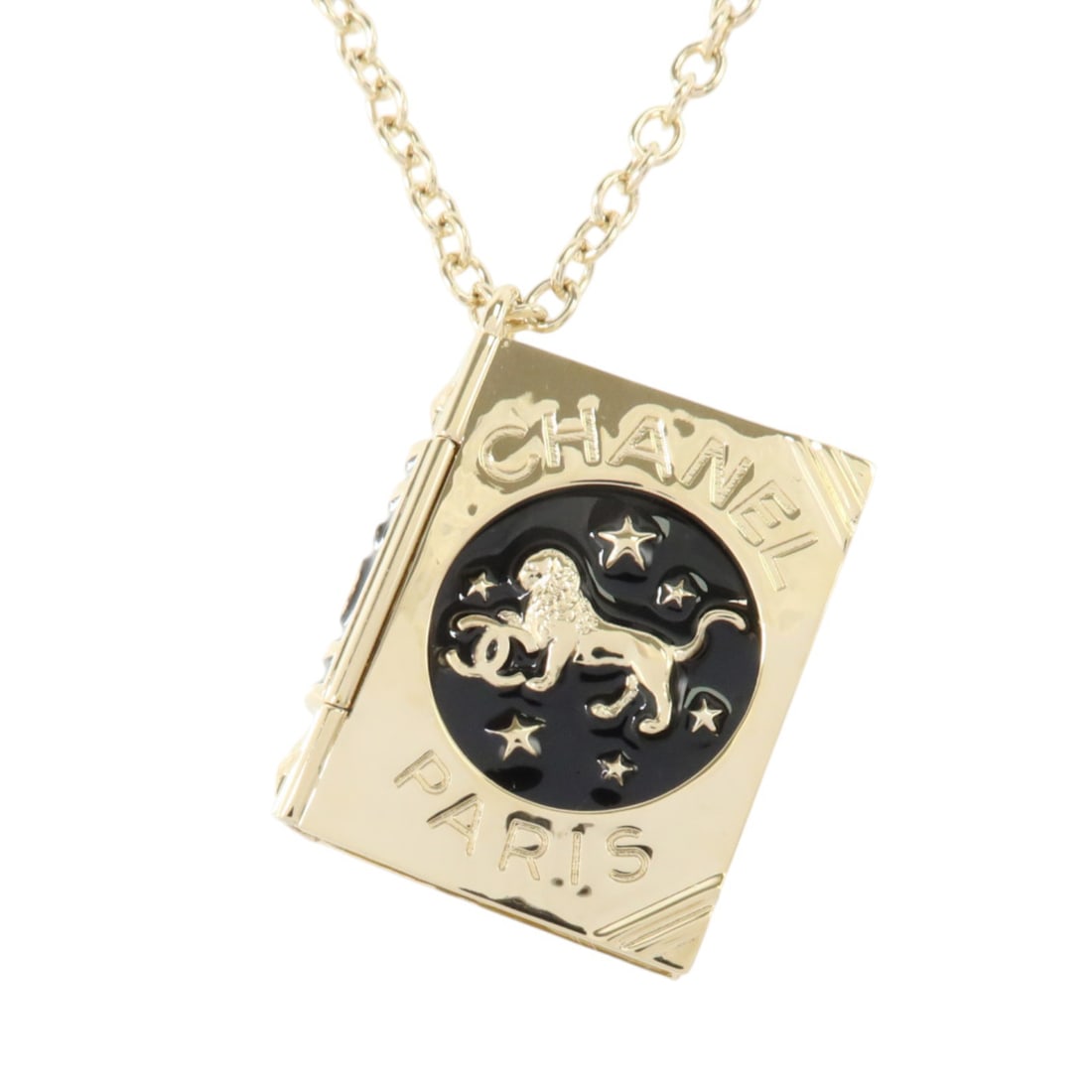 CHANEL AB7521 Lion Book Locket Pendant Necklace Black Enamel Gold Tone: CHANEL AB7521 Lion Book Locket Pendant Necklace Black Enamel Gold Tone Lion book locket pendant necklace in black enamel and metal with gold-tone and light gold-tone coloring. Includes a storage box. 
