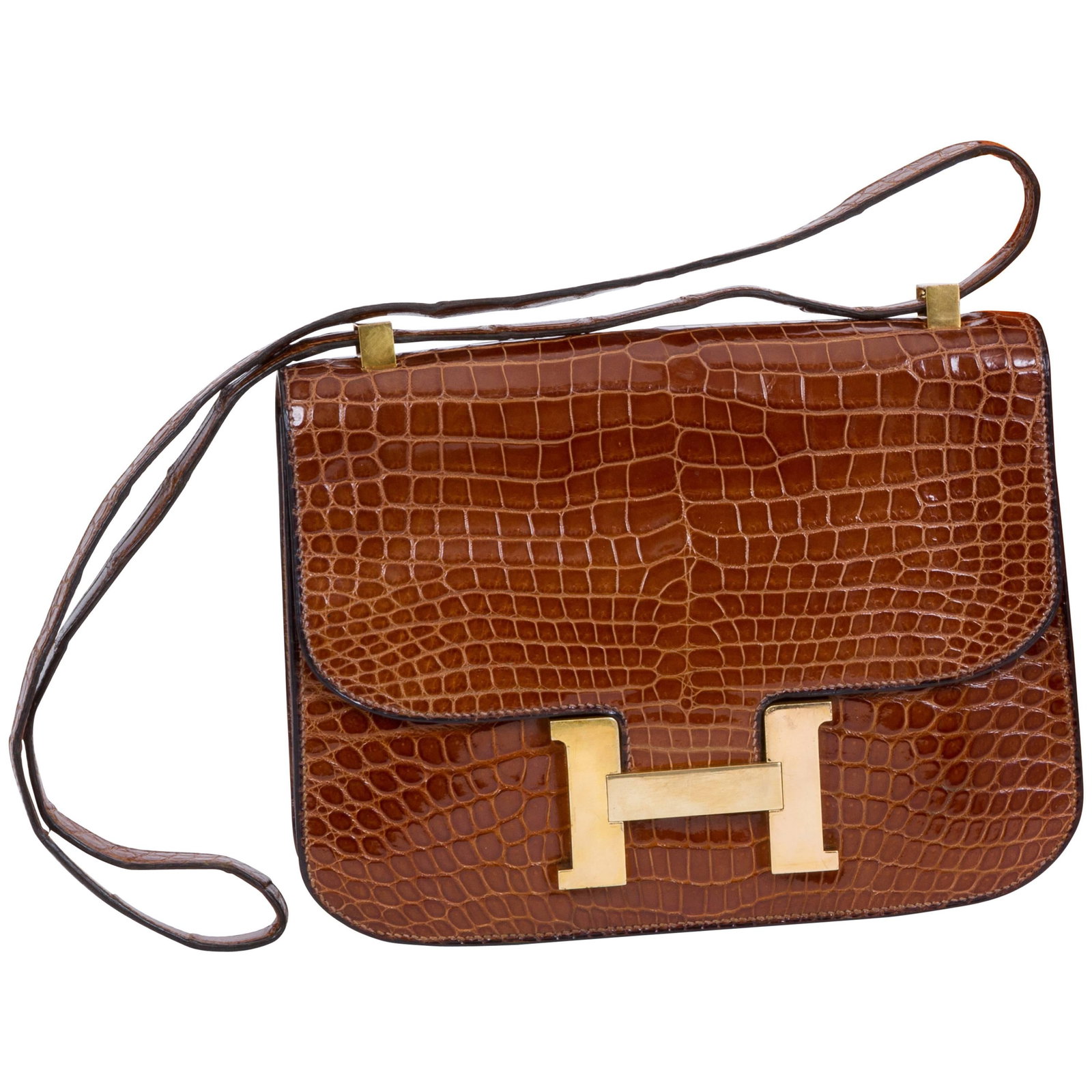 Hermes Vintage Crocodile Miel Constance Bag with Box: Hermes Vintage Crocodile Miel Constance Bag with Box Introducing the Hermes Vintage Crocodile Miel Constance bag, a timeless piece that embodies elegance and sophistication. Crafted from luxurious cro
