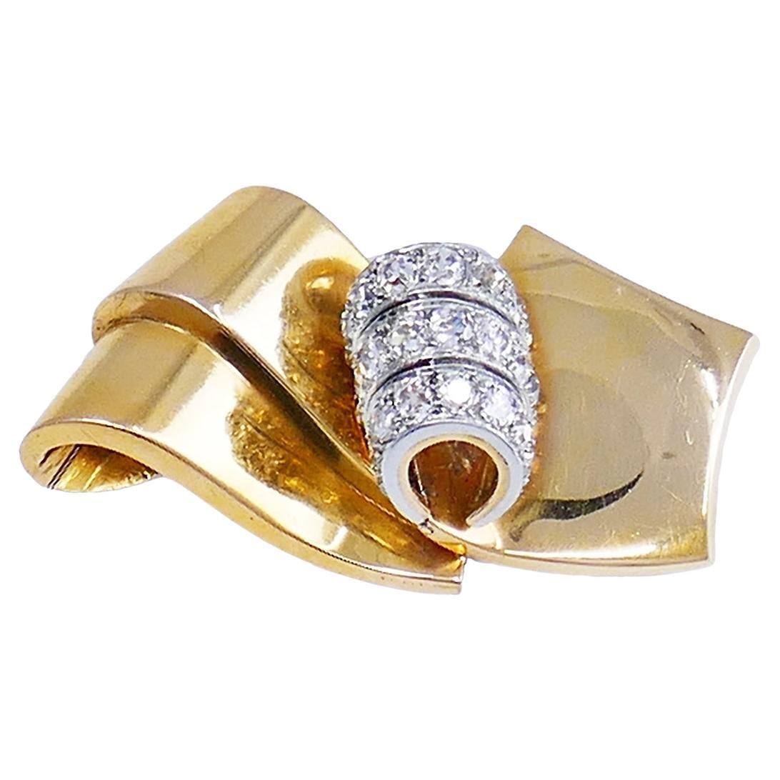 Chaumet French Retro Diamond Brooch in 18k Gold and Platinum: Chaumet French Retro Diamond Brooch in 18k Gold and Platinum French Retro brooch by Chaumet Paris featuring a sculptural scroll design in 18k yellow gold and platinum, accented with mixed-cut diamonds