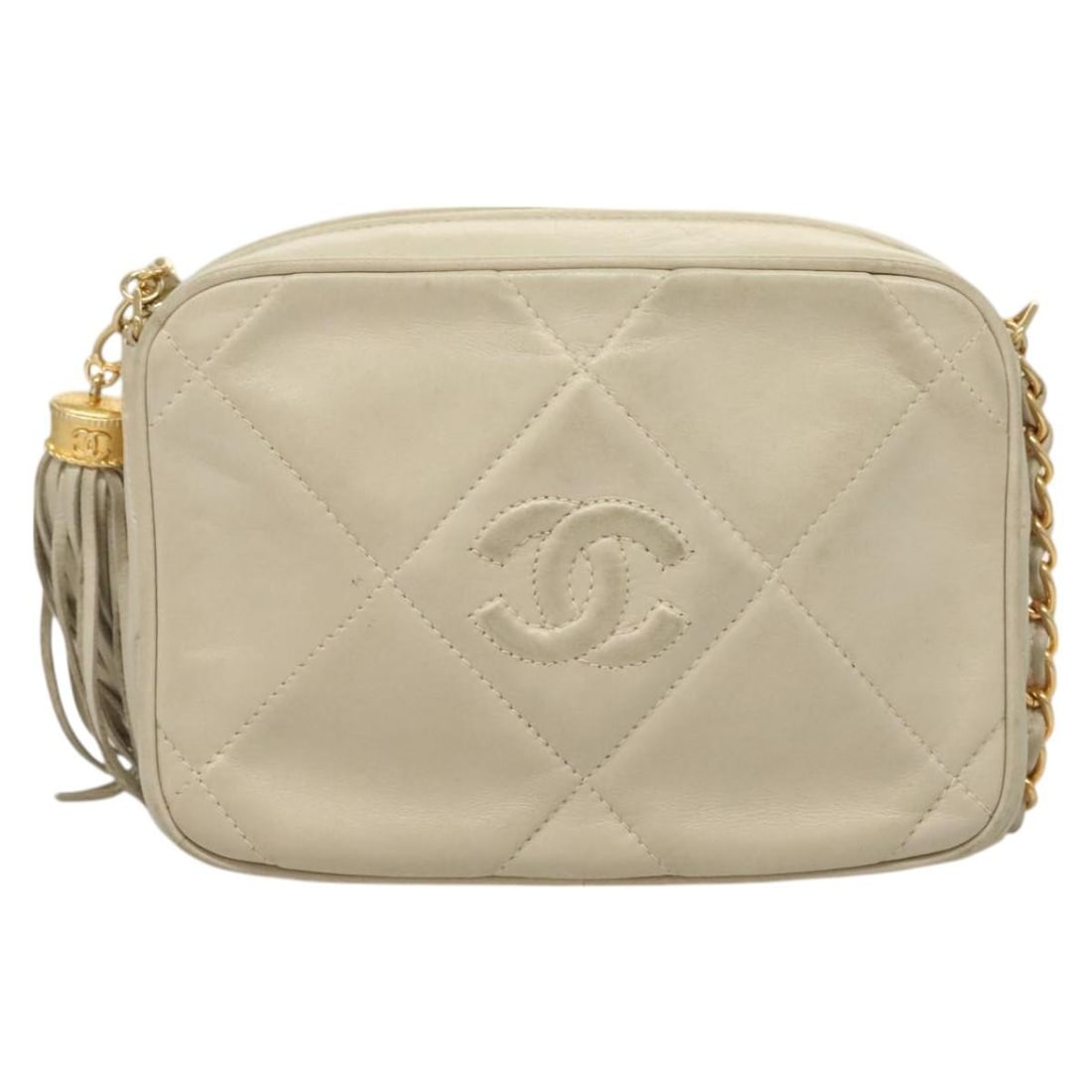 Chanel Lambskin Quilted Vintage Diamond CC Camera Bag Beige: Chanel Lambskin Quilted Vintage Diamond CC Camera Bag Beige This vintage Chanel Diamond CC Camera Bag is crafted from beige quilted lambskin leather. Designed for women, it features a compact silhouet