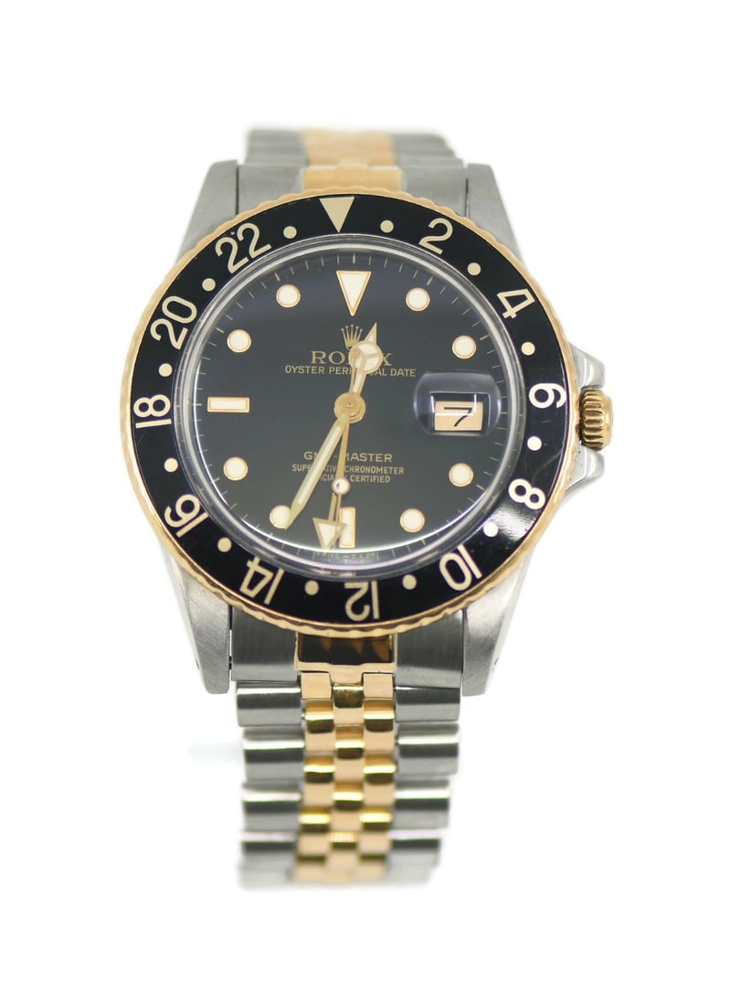 Rolex GMT-Master 18K Stainless Steel Watch Ref 16753 with Box: Rolex GMT-Master 18K Stainless Steel Watch Ref 16753 with Box This exquisite Rolex GMT-Master watch blends luxury and functionality, featuring an 18K gold and stainless steel case that measures 40 mm 