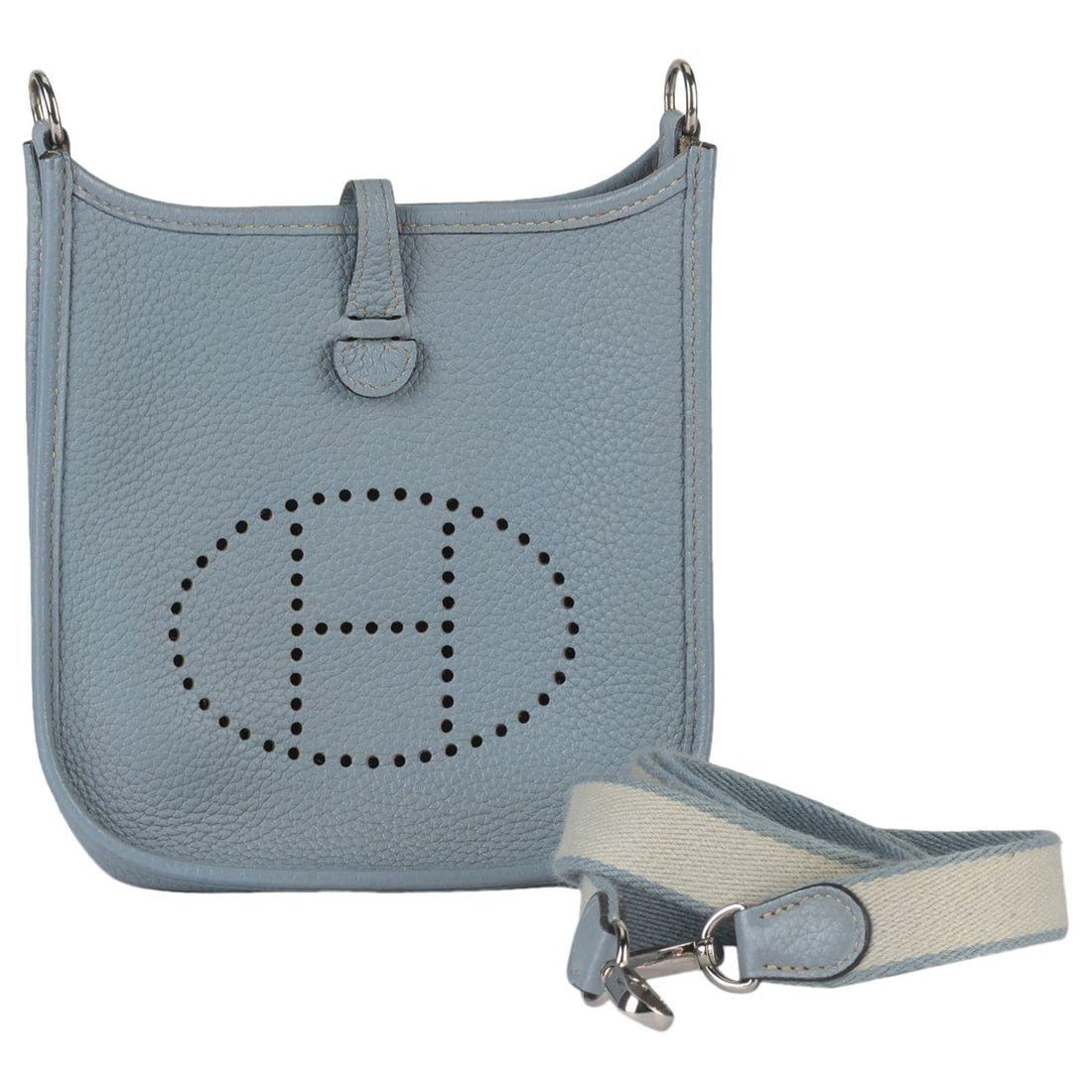 Hermes Mini Evelyne Crossbody Bag in Jaune Ambre Clemence Leather: Hermes Mini Evelyne Crossbody Bag in Jaune Ambre Clemence Leather Introducing the exquisite Hermes Blue Lin Mini Evelyne Cross Bag, a chic accessory that perfectly blends style and functionality. Craf