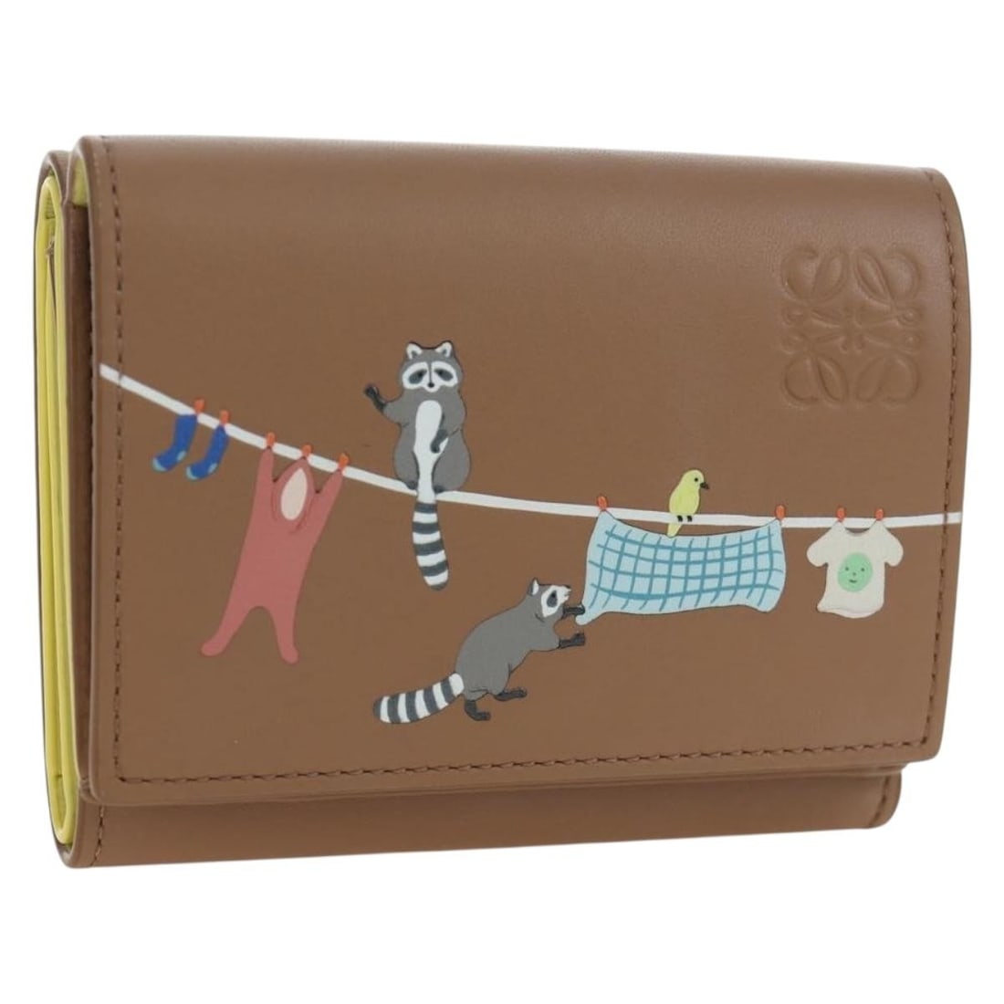 LOEWE Suna Fujita trifold leather wallet brown silver tone: LOEWE Suna Fujita trifold leather wallet brown silver tone LOEWE trifold wallet in brown leather with silver-tone accents from the Suna Fujita line. Made in Spain, this women's wallet includes the dus