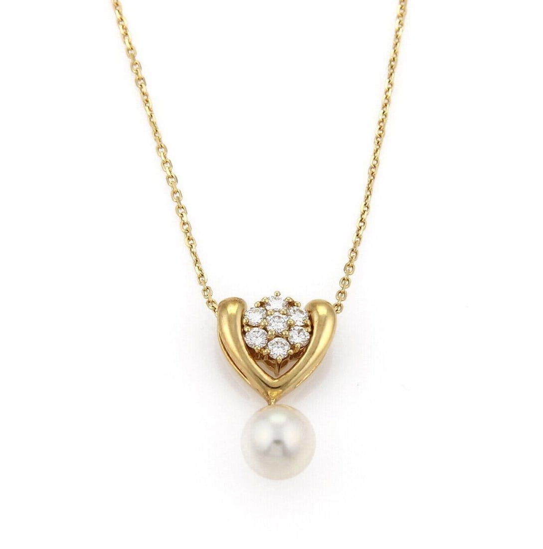 Mikimoto Akoya Pearl Diamond Pendant Necklace in 18k Yellow Gold 15.75": Mikimoto Akoya Pearl Diamond Pendant Necklace in 18k Yellow Gold 15.75" Vintage Mikimoto pendant necklace featuring an Akoya pearl accented by a diamond in an elegant 18k yellow gold design. This orig