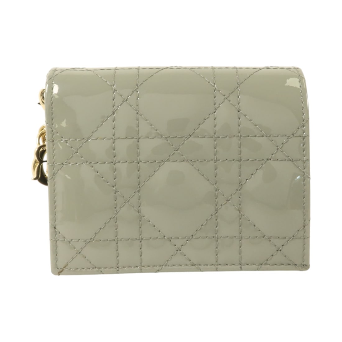 Dior Gardenia S0178OVRB bi fold wallet in gray patent leather: Dior Gardenia S0178OVRB bi fold wallet in gray patent leather Christian Dior Gardenia bi-fold wallet in gray patent leather with CD GHW styling. This women's wallet features a hook button closure with
