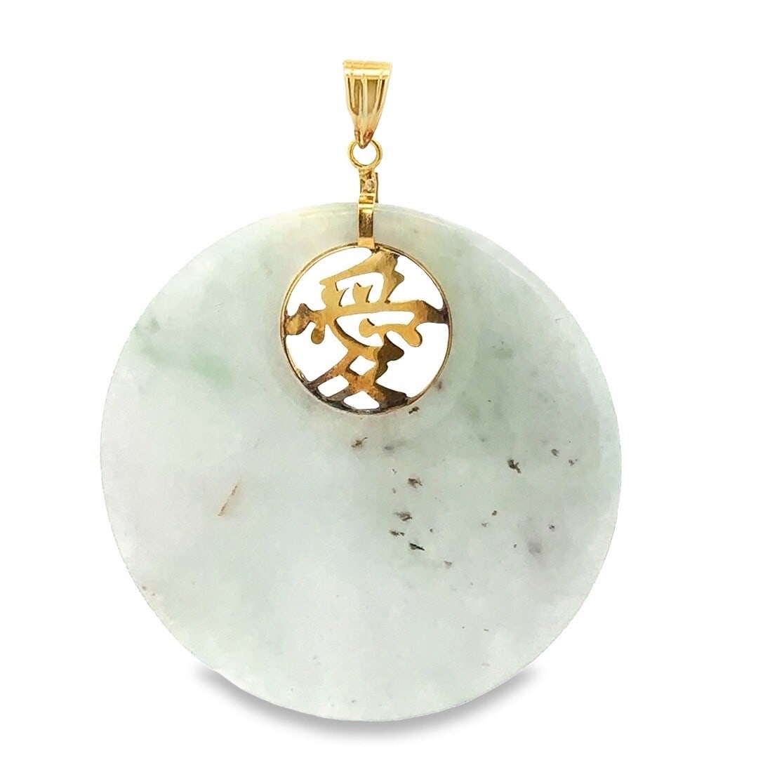 Vintage 14K Gold Green Jade Chinese Symbol Medallion Pendant: Vintage 14K Gold Green Jade Chinese Symbol Medallion Pendant This exquisite vintage pendant features a stunning round light green jade medallion accented with an intricate pierced Asian symbol. Crafte