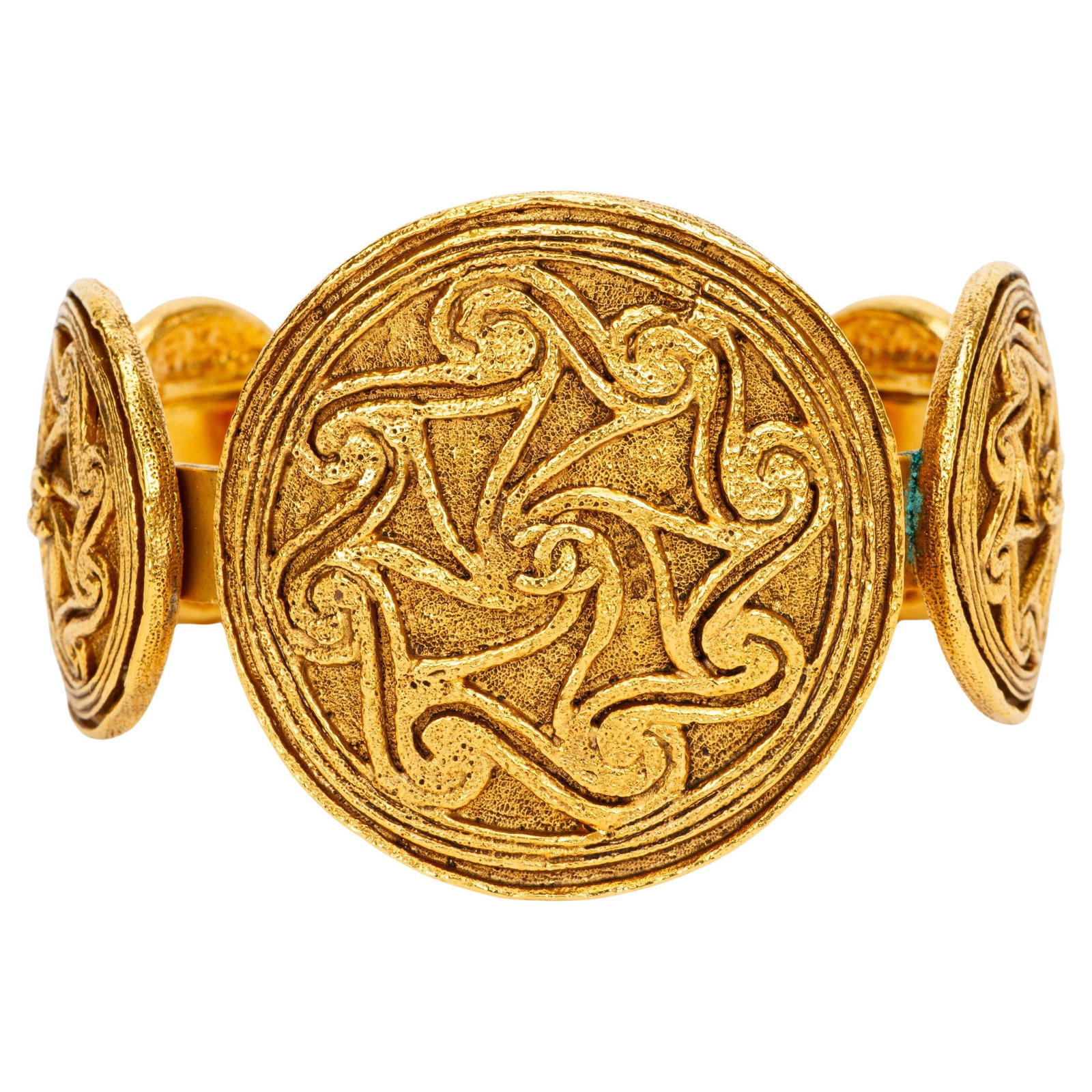 Chanel gold plated shield medallion cuff bracelet: Chanel gold plated shield medallion cuff bracelet This Chanel 1980s Shields Gold Cuff is crafted in gold-plated metal and features distinctive medallion shield motifs encircling the cuff. Designed to 