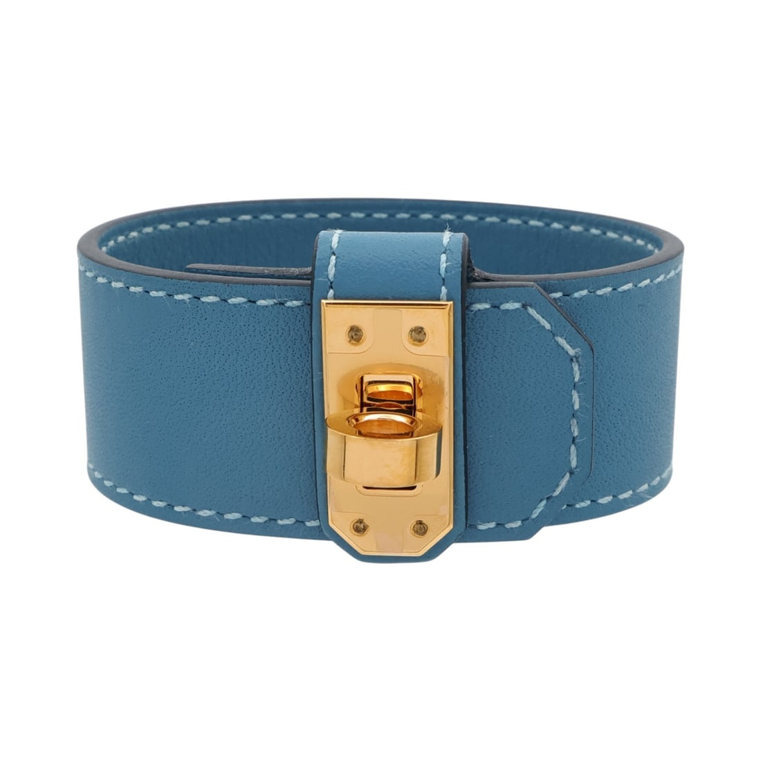 Hermes Kelly Twist Bracelet Blue Jean Swift Leather GHW: Hermes Kelly Twist Bracelet Blue Jean Swift Leather GHW Hermes Kelly Twist bracelet in Blue Jean Swift leather and calfskin with GHW. Made in France, this women's bracelet features a wrap-style design