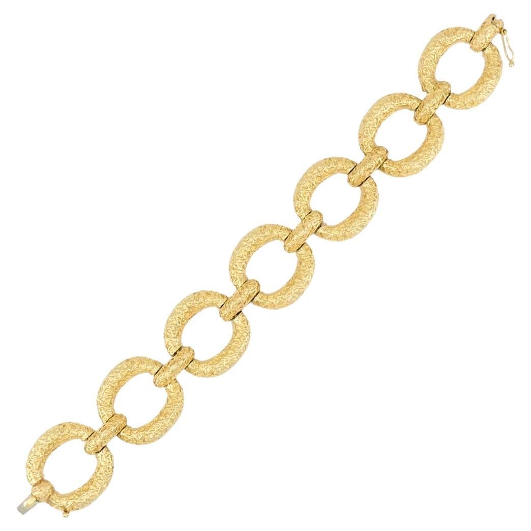 14k Yellow Gold Circular Link Bracelet with Textured Finish: 14k Yellow Gold Circular Link Bracelet with Textured Finish Vintage estate bracelet crafted in 14k yellow gold with circular links joined by smaller connectors. Each link features a textured finish th