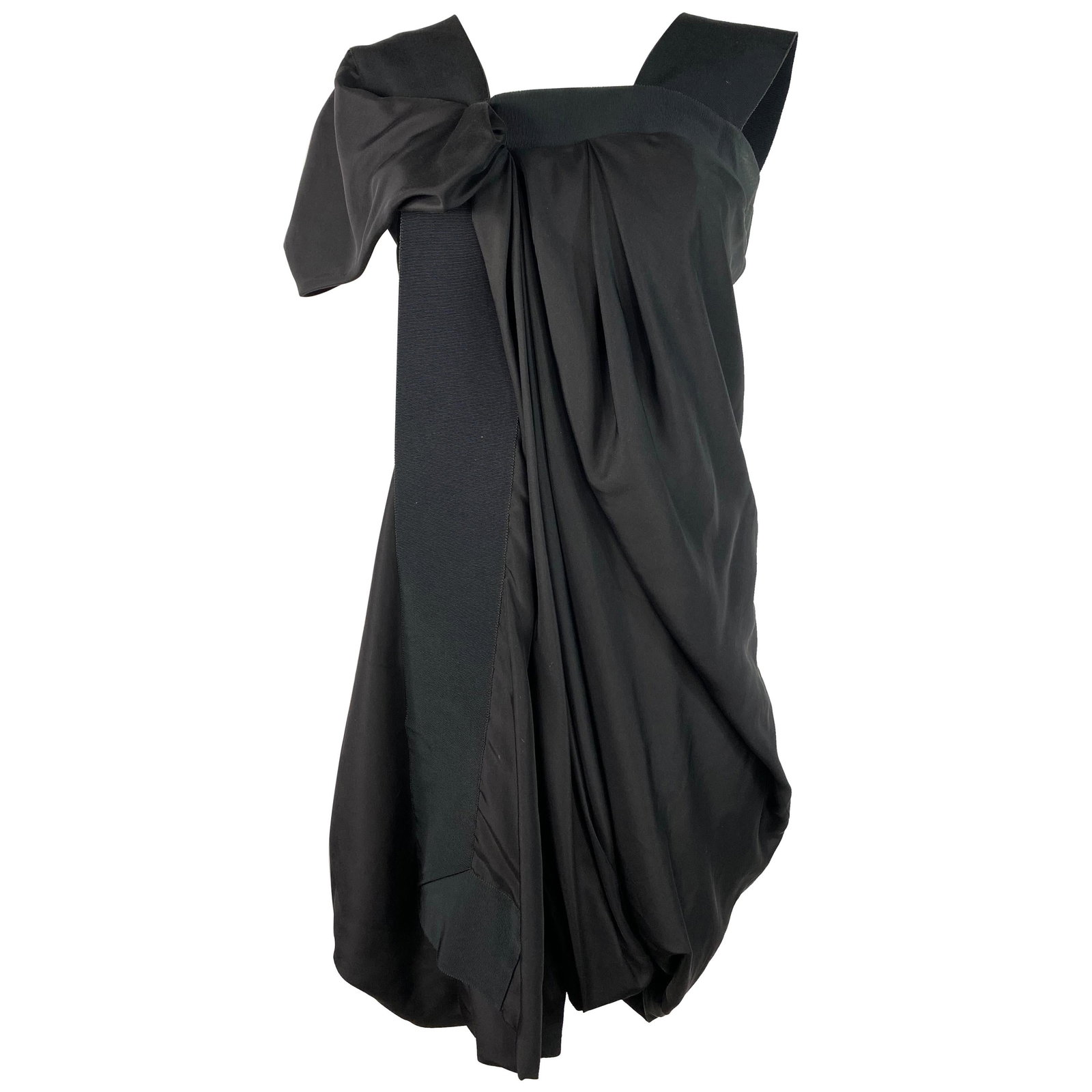 Celine Size 42 Asymmetrical Mini Dress in Black Silk: Celine Size 42 Asymmetrical Mini Dress in Black Silk Black 100% silk mini dress by Celine in an asymmetrical style, featuring a silver tone rear zip closure. Made in France, this piece is marked size 