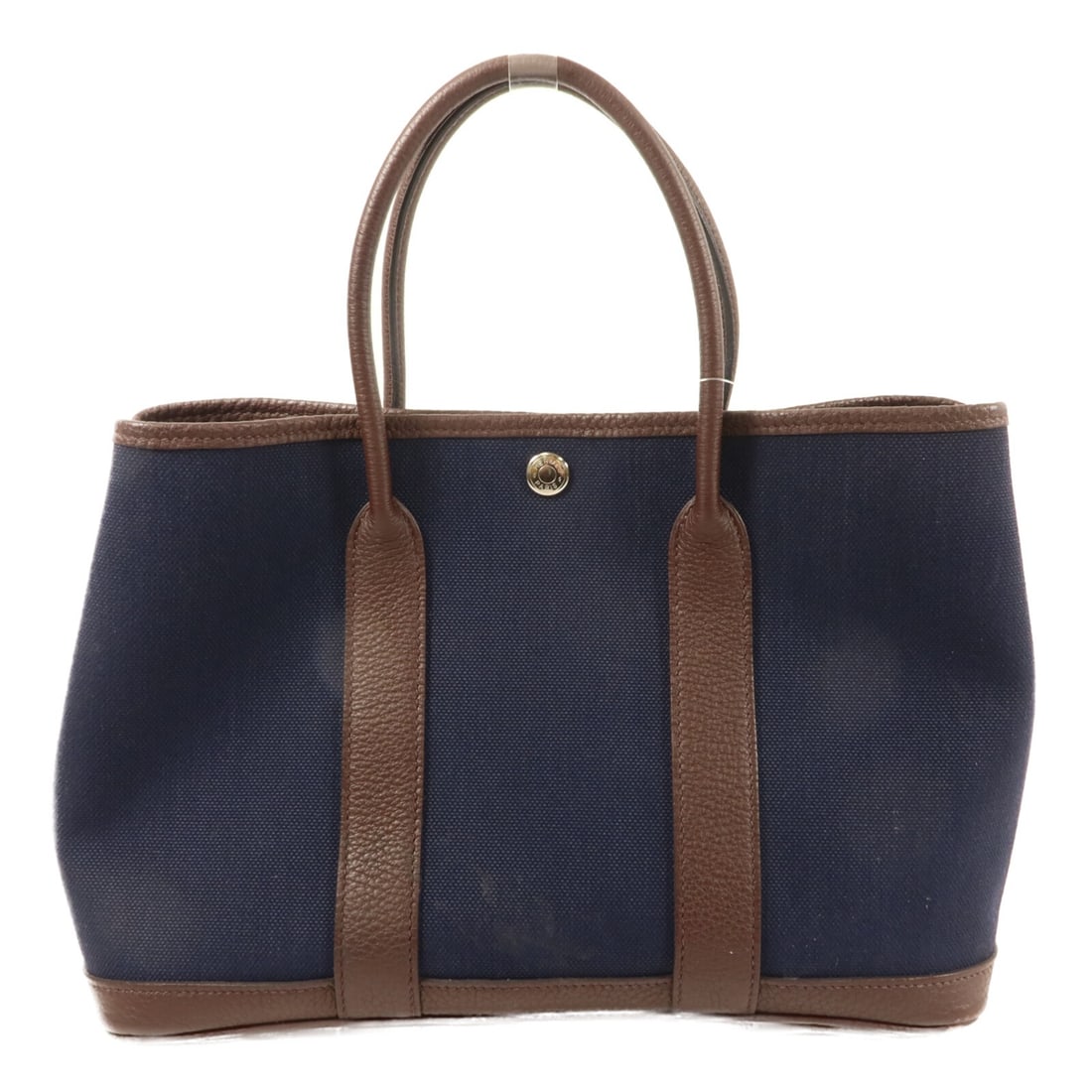 Hermes Garden Party TPM Canvas Handbag Navy PHW: Hermes Garden Party TPM Canvas Handbag Navy PHW Hermes Garden Party TPM tote bag in Bleu Marine canvas with palladium-tone hardware. Made in France, this women's handbag features a structured tote sil