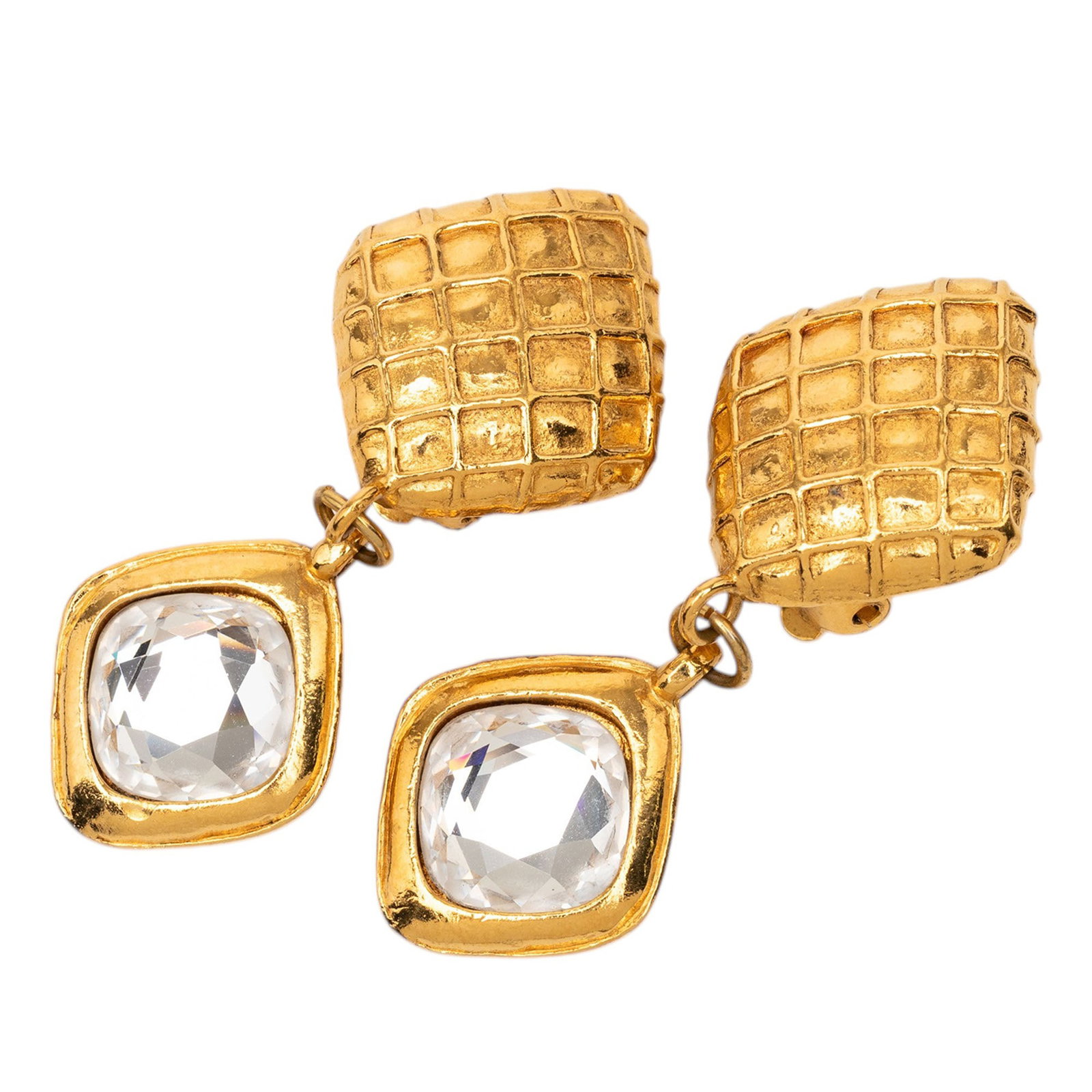 Chanel quilted strass clip on drop earrings gold plated: Chanel quilted strass clip on drop earrings gold plated These Chanel clip-on earrings feature a gold-plated metal construction with a quilted diamond-shaped design and rhinestone embellishments. The e