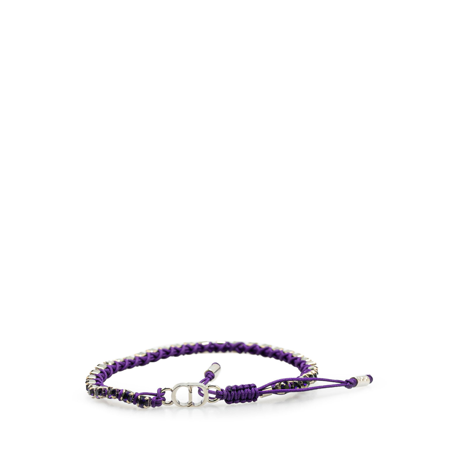 Dior Crystal Cord Adjustable Palladium Plated Bracelet: Dior Crystal Cord Adjustable Palladium Plated Bracelet This Dior bracelet showcases a modern design with palladium plating and cord details. Crafted in Italy, it features a silver tone and an adjustab