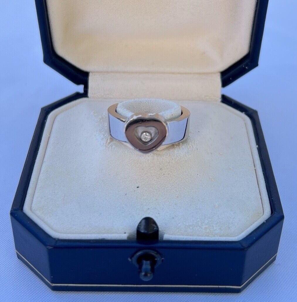 Chopard 18K White Gold Love Ring with Diamond 0.05ct Size 6.75: Chopard 18K White Gold Love Ring with Diamond 0.05ct Size 6.75 This exquisite Chopard Love Ring is crafted from 18K white gold and features a stunning diamond, approximately 0.05ct GVS, set within