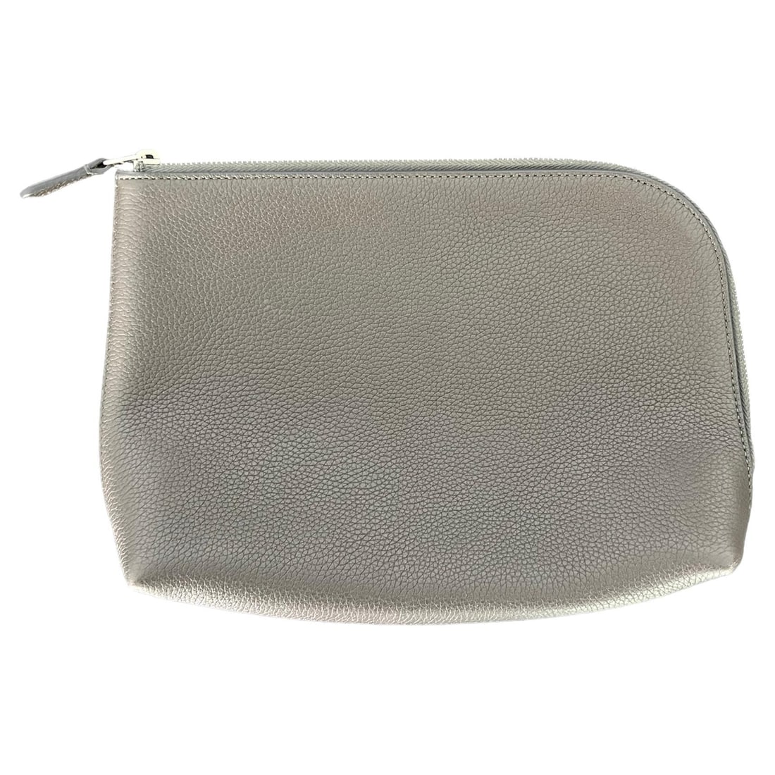 The Row Medium Leather Pouch Clutch in Ash Grey: The Row Medium Leather Pouch Clutch in Ash Grey Medium pouch clutch by The Row in ash grey leather with a silver tone top zip closure. Made in Italy and includes the original dust bag. Condition is ex