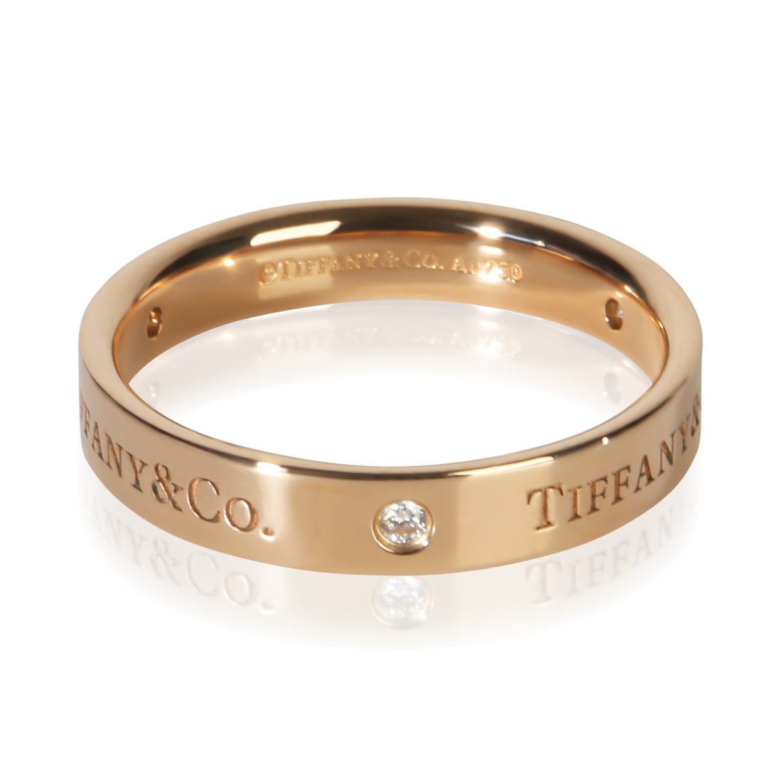 Tiffany & Co. T&Co. 18k Rose Gold Diamond Mens Band Ring Size 10: Tiffany & Co. T&Co. 18k Rose Gold Diamond Mens Band Ring Size 10 Pre-owned Tiffany & Co. T&Co. band ring crafted in rose gold and set with round brilliant diamonds. This men's band comes with its orig