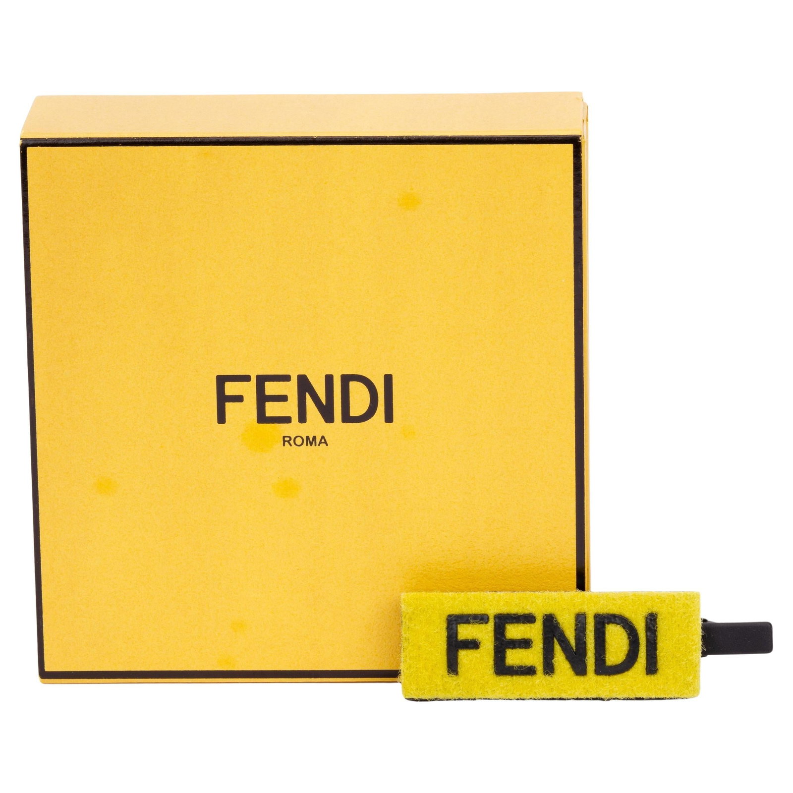 Fendi Yellow Velcro Hairclip with Logo Italy 21st Century: Fendi Yellow Velcro Hairclip with Logo Italy 21st Century Elevate your style with this Fendi Velcro hairclip in a striking yellow and black design. This rectangular hair accessory features the iconic 