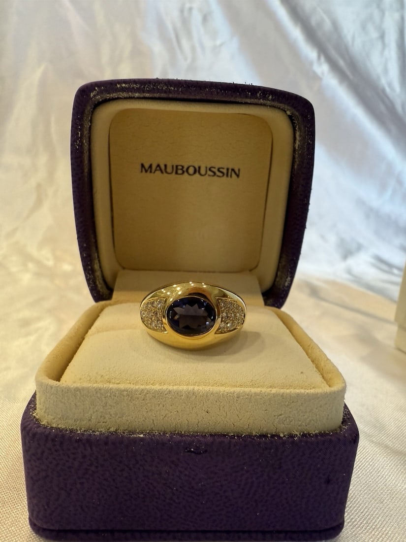 Mauboussin 18K Gold Diamond Iolite Ring Size 4 with Box: Mauboussin 18K Gold Diamond Iolite Ring Size 4 with Box This exquisite French Mauboussin ring features 18K yellow gold, showcasing a stunning design complemented by a diamond and iolite centerpiece. T