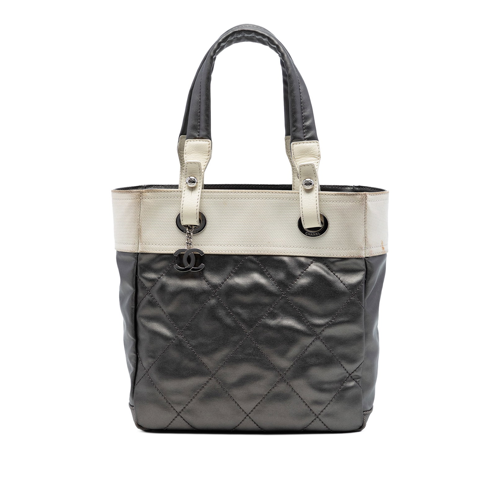 Chanel Paris Biarritz Small Tote Gray Quilted Coated Canvas: Chanel Paris Biarritz Small Tote Gray Quilted Coated Canvas Chanel Small Bicolor Quilted Coated Canvas Paris Biarritz Tote in gray. It features a quilted coated canvas body with nylon trim, flat handl