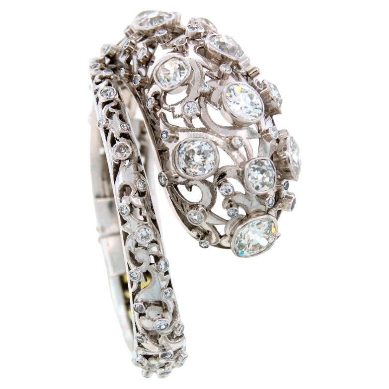 Lalaounis Platinum Snake Bangle with 16 Carats of Diamonds: Lalaounis Platinum Snake Bangle with 16 Carats of Diamonds Vintage Lalaounis snake bangle crafted in platinum and set with approximately 16 carats of antique cushion cut diamonds. Custom made by Ilias