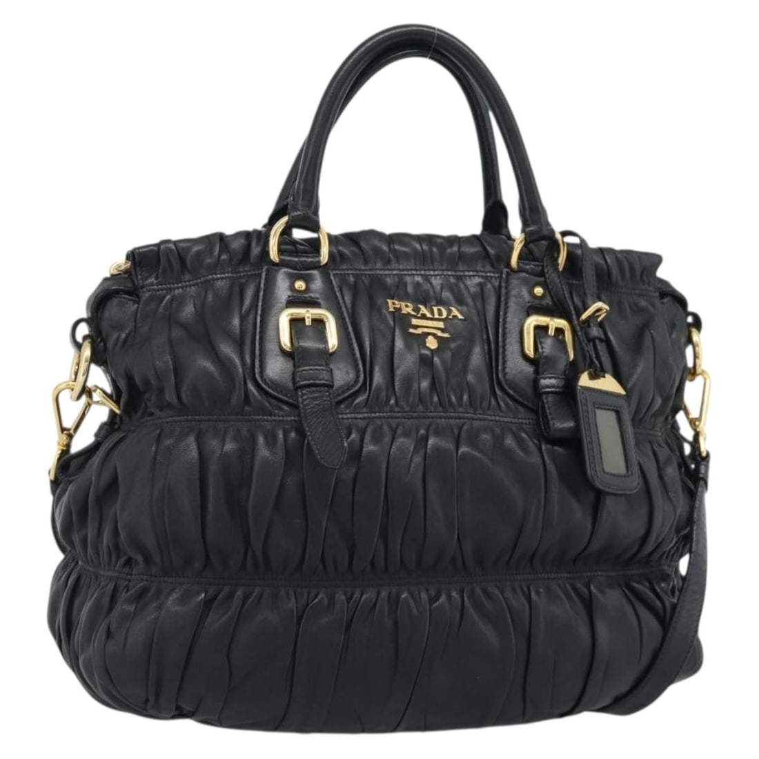 PRADA black leather 2 way handbag with strap and dust bag: PRADA black leather 2 way handbag with strap and dust bag A PRADA gathered leather 2-way handbag in black with gold-tone details. It comes with a dust bag, name tag, and shoulder strap. Made in Italy,