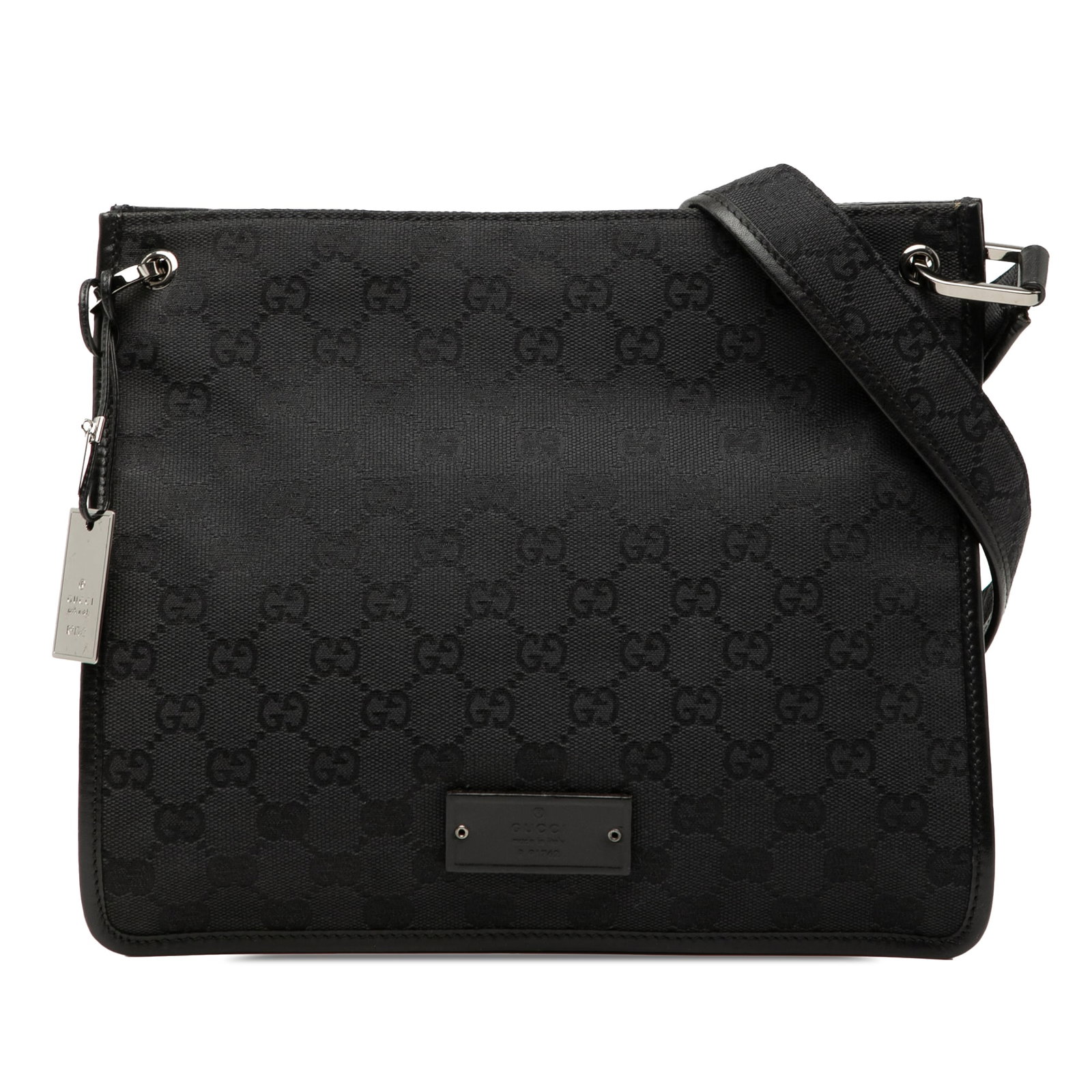 Gucci GG Canvas Black Crossbody Bag with Leather Trim: Gucci GG Canvas Black Crossbody Bag with Leather Trim Gucci GG Canvas Crossbody bag with leather trim and an adjustable strap. The bag features an open top with a magnetic closure and an interior zip 