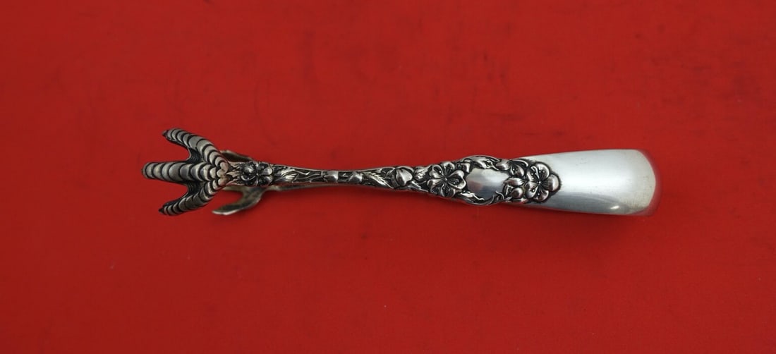 Dominick & Haff Blossom Sterling Silver Sugar Tong 4 3/4 inches: Dominick & Haff Blossom Sterling Silver Sugar Tong 4 3/4 inches This exquisite sugar tong is a stunning piece from the Blossom pattern by Dominick & Haff. Crafted from high-quality sterling silver, it
