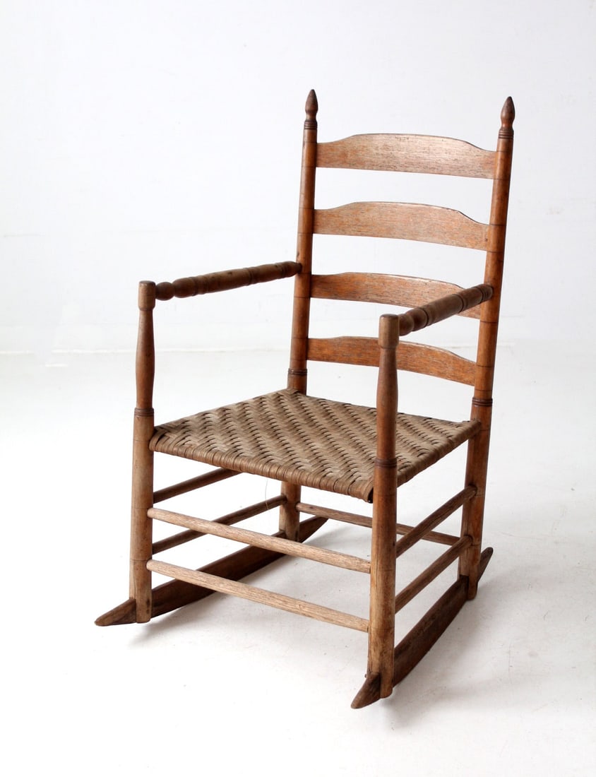 Rustic Antique Splint Weave Rocking Chair with Herringbone Seat: Rustic Antique Splint Weave Rocking Chair with Herringbone Seat This antique splint weave seat rocking chair showcases a rustic design with a handmade feel. It features a classic ladder back, a herrin