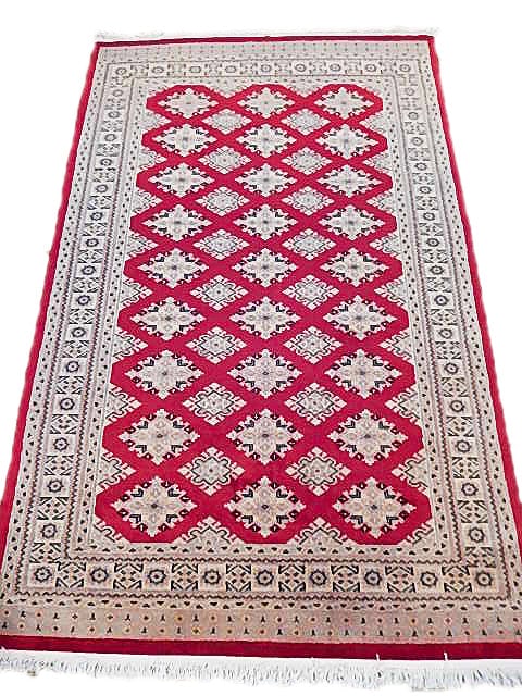 4' x 6.3' Red Hand-Knotted Jaldar Bokhara Rug from Pakistan: 4' x 6.3' Red Hand-Knotted Jaldar Bokhara Rug from Pakistan Free continental US Shipping Enhance your living space with this stunning 4' x 6' Red Jaldar Bokhara Rug, a true masterpiece of traditional 