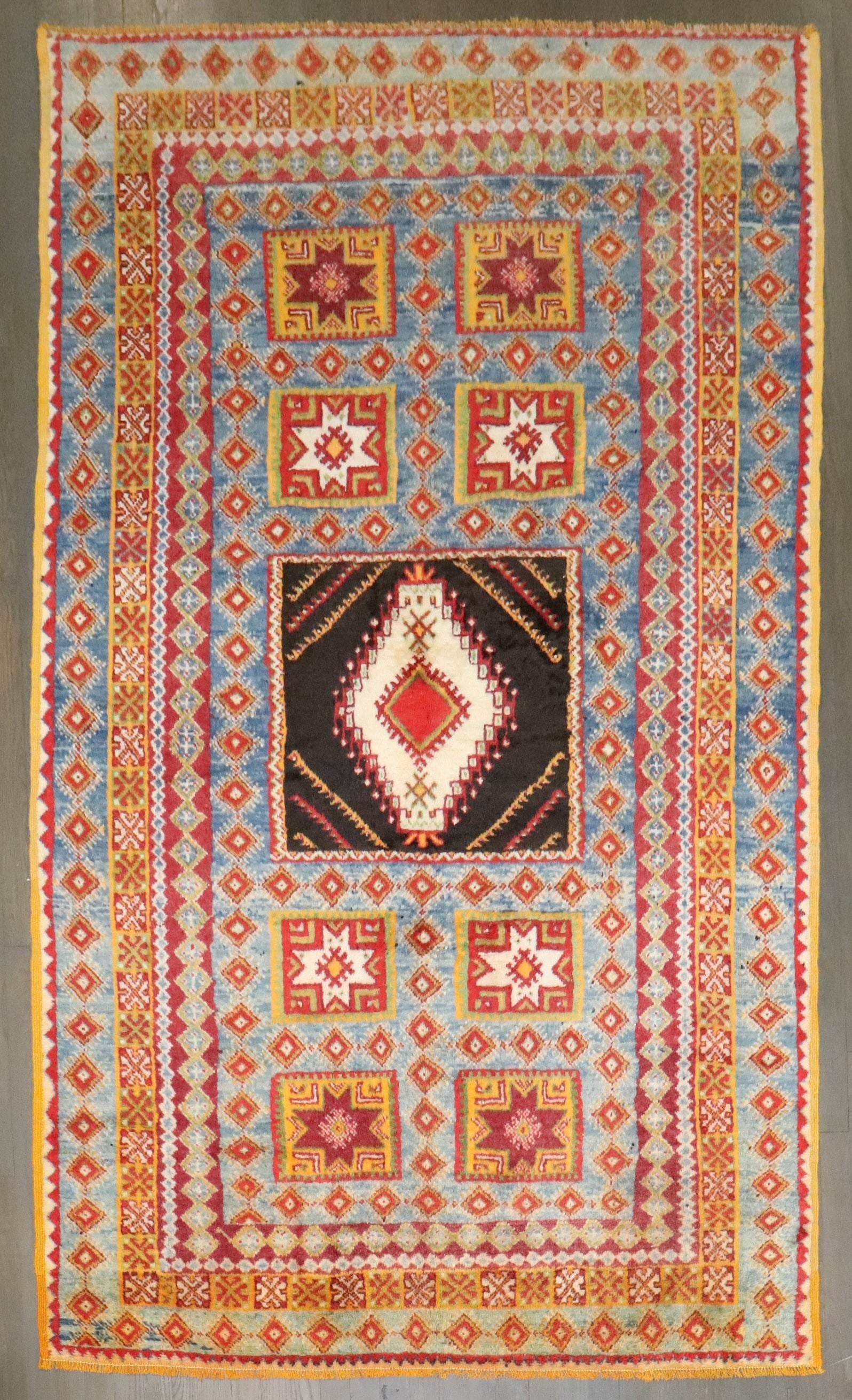 5' x 8' 1" Mid 20th Century Moroccan Geometric Rug: 5' x 8' 1" Mid 20th Century Moroccan Geometric Rug Vintage Moroccan rug with a geometric design, dating to the mid-20th century. This pre-owned piece offers classic Moroccan character and style. Speci