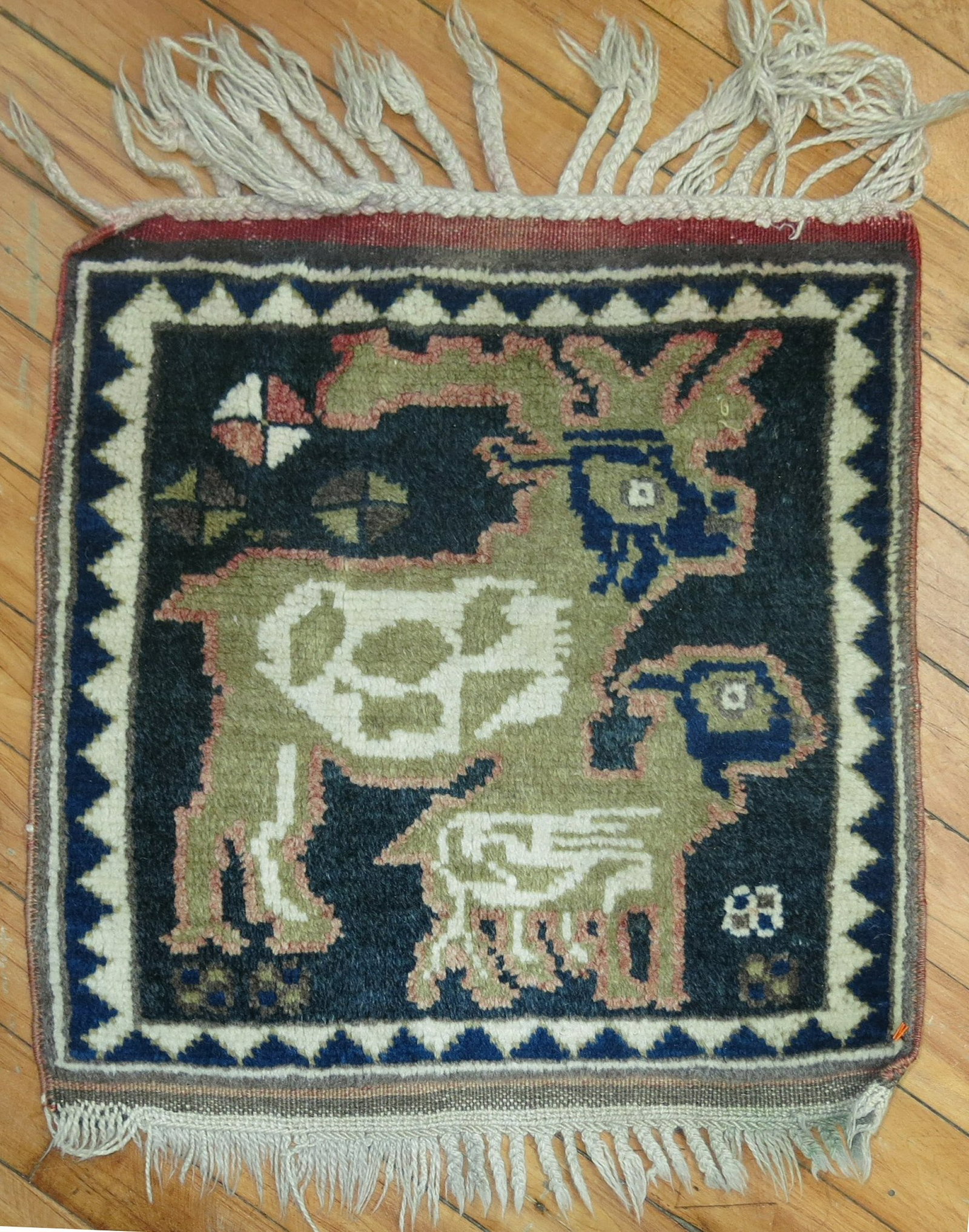 Square Pictorial Persian Yastik Rug 1' 5" x 1' 5": Square Pictorial Persian Yastik Rug 1' 5" x 1' 5" Mid 20th century Persian pictorial square mat in a compact yastik form. This pre-owned rug features a pictorial design and small-scale square format. 