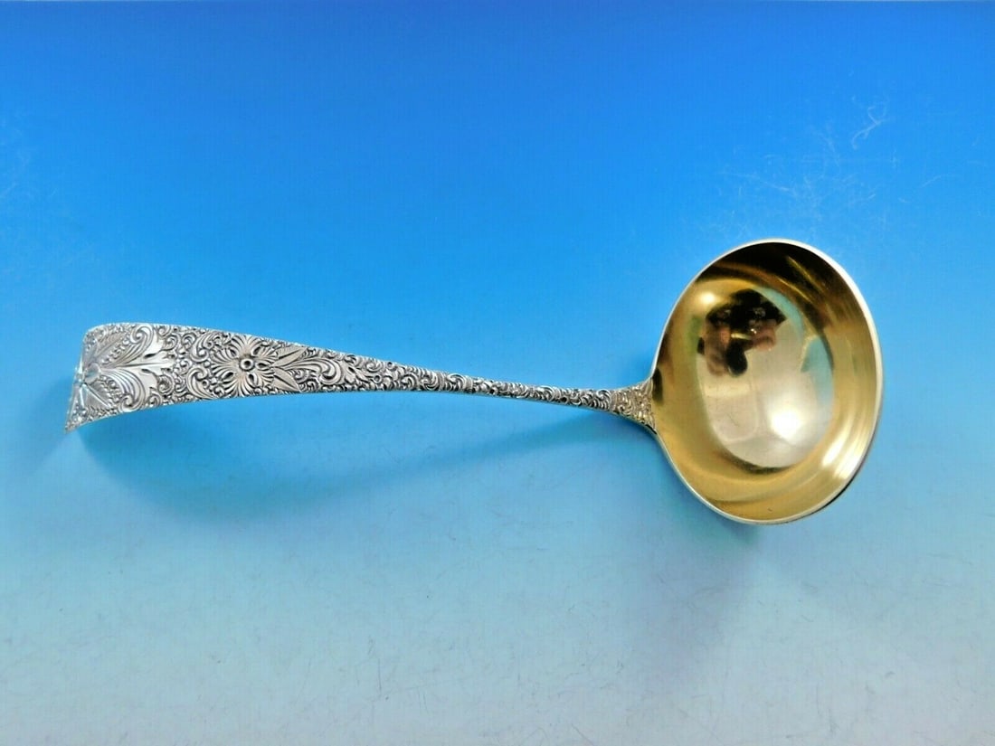 J.E. Caldwell Antique Engraved Sterling Silver Gravy Ladle Gold Wash 7.5": J.E. Caldwell Antique Engraved Sterling Silver Gravy Ladle Gold Wash 7.5" This exquisite gravy ladle, crafted by J.E. Caldwell, is a stunning example of antique silverware. Made from high-quality ster
