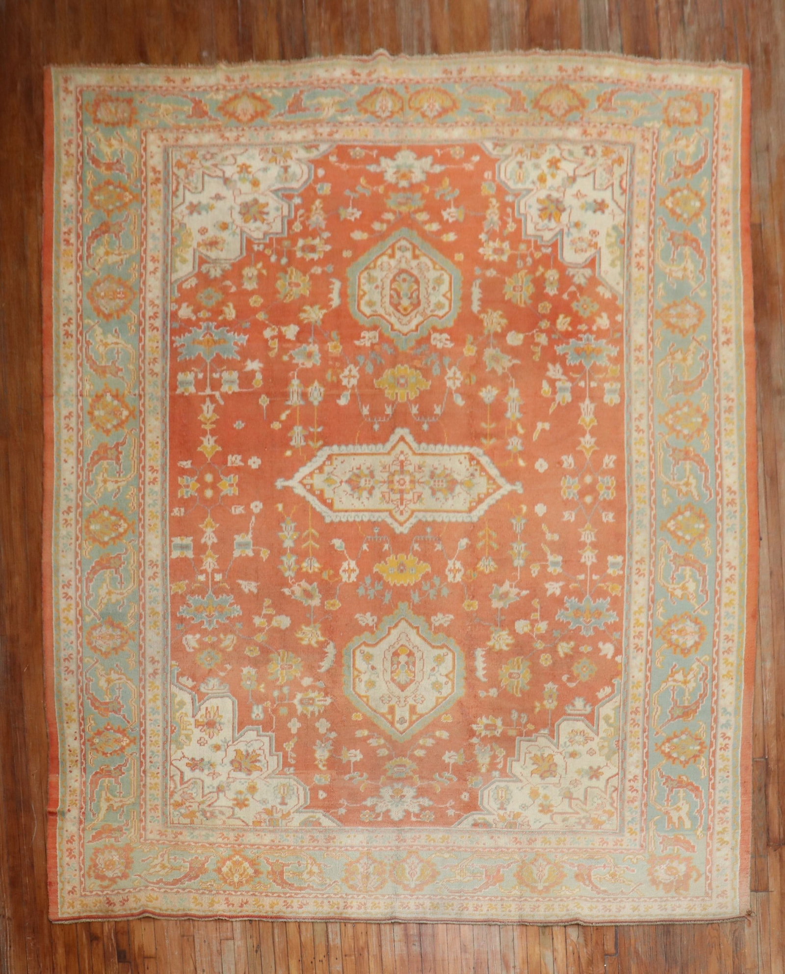 10' 4" x 13' 7" Turkish Oushak Room Rug Orange Field Ivory Border: 10' 4" x 13' 7" Turkish Oushak Room Rug Orange Field Ivory Border Early 20th century Turkish Oushak rug with an orange field and ivory border. This pre-owned room-size rug is identified as an Oushak. 