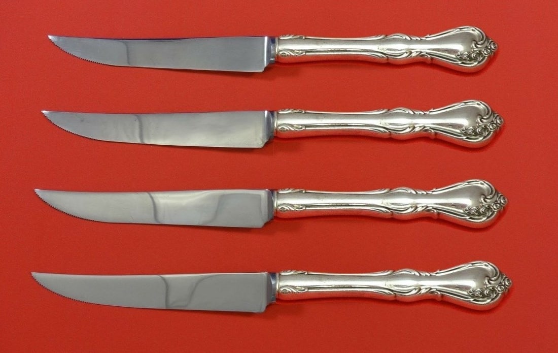 Reed & Barton Rose Cascade Sterling Silver Steak Knife Set 4pc: Reed & Barton Rose Cascade Sterling Silver Steak Knife Set 4pc This exquisite 4-piece steak knife set features the elegant Rose Cascade pattern by Reed & Barton. Each knife is crafted with a sterling 