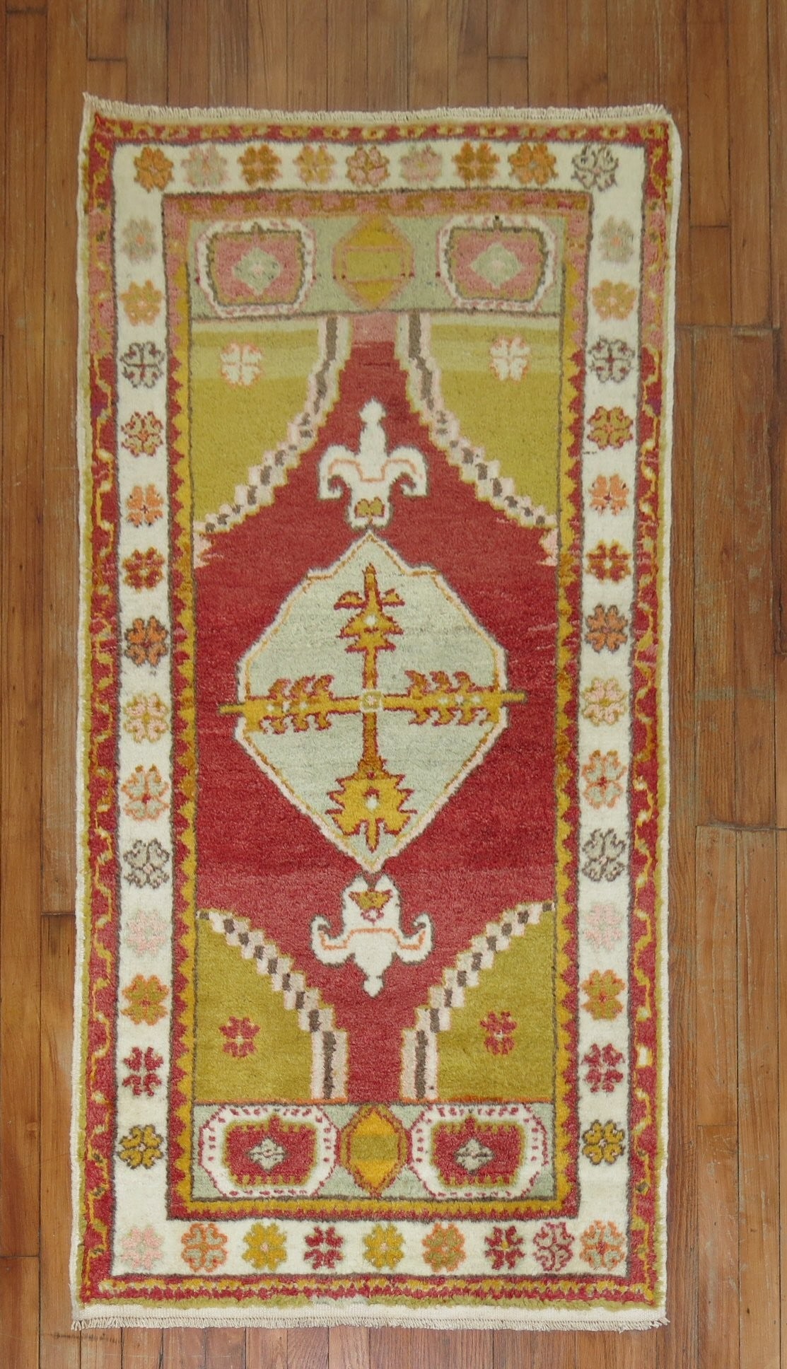 2' 9" x 5' Turkish Oushak Small Vintage Rug: 2' 9" x 5' Turkish Oushak Small Vintage Rug Mid-20th century Turkish Oushak rug in colorful tones with a vibrant geometric design and floral border motifs. This small rug is described as being in full