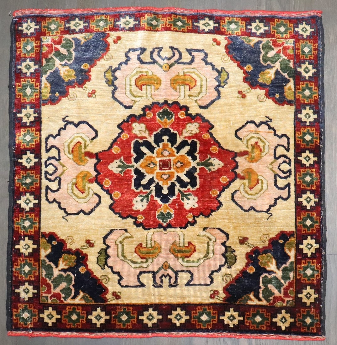 Antique Khotan Silk Rug 1'9" x 1'10" Handwoven China: Antique Khotan Silk Rug 1'9" x 1'10" Handwoven China Antique hand-knotted silk Khotan rug from Xinjiang, Western China, featuring a central lotus medallion with floral and geometric border motifs. Thi